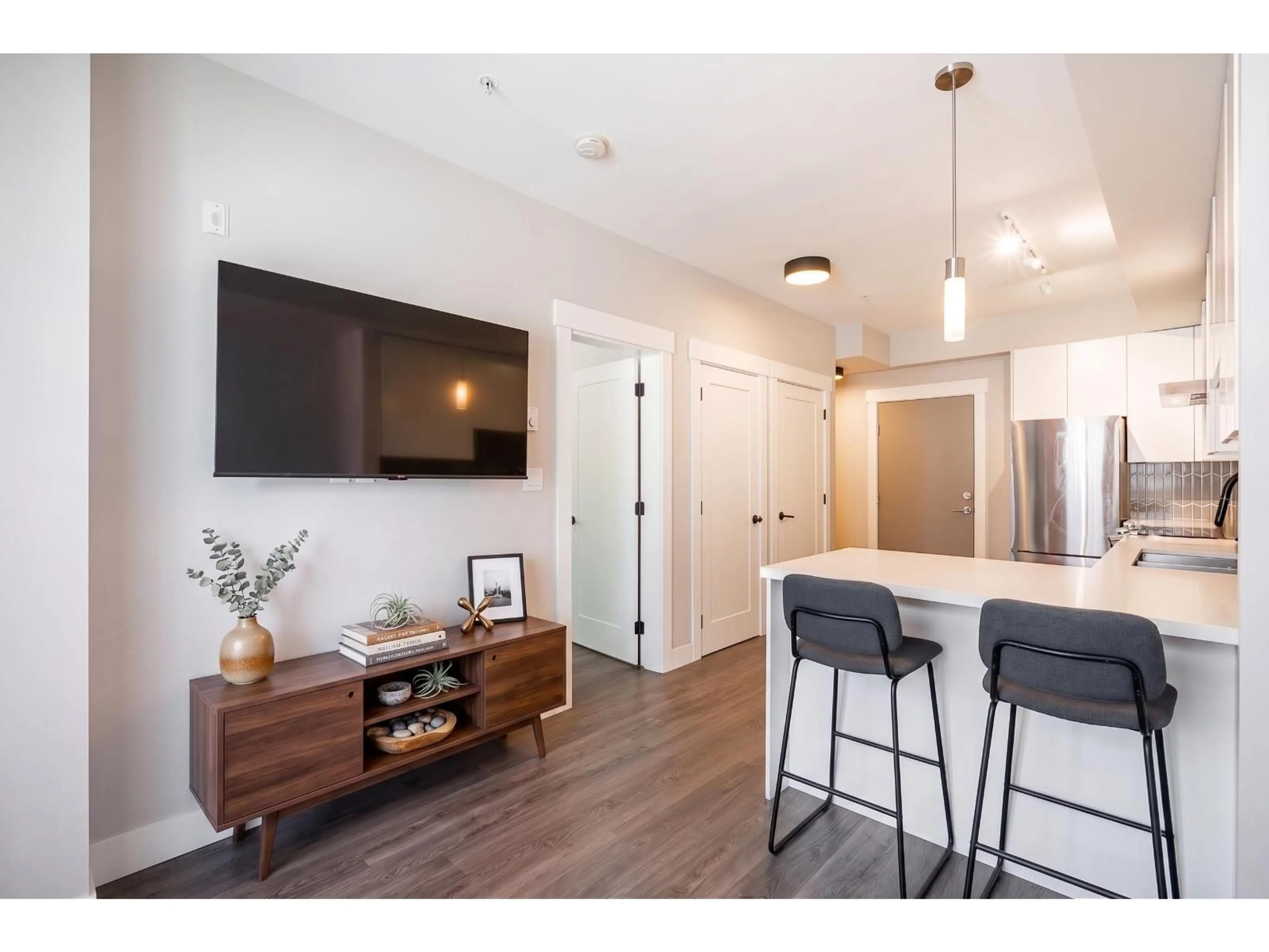 Open concept kitchen, wood/laminate floor for A114 - 20838 78B AVENUE, Langley British Columbia V2Y3M1