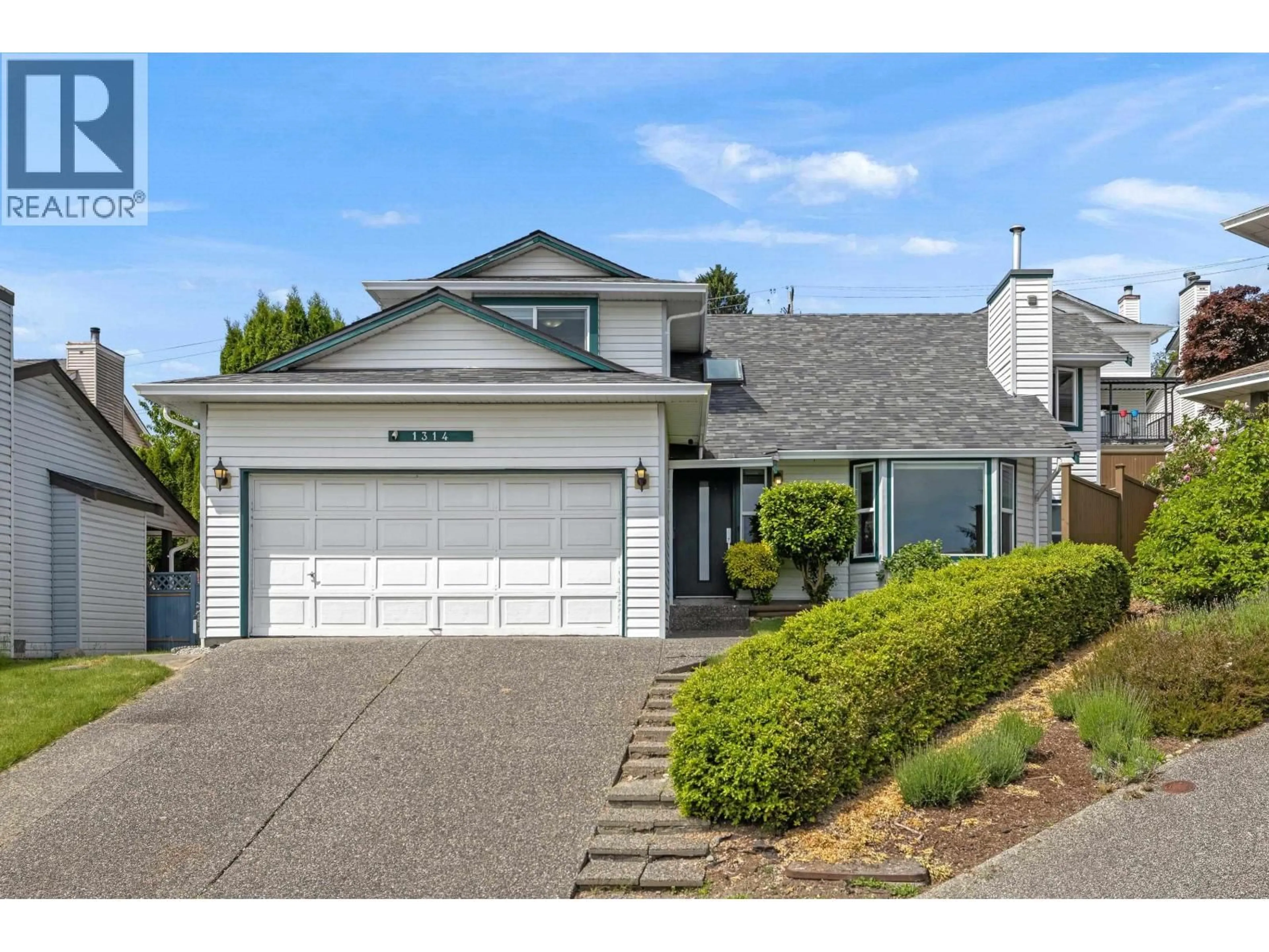 Home with vinyl exterior material, street for 1314 DAIMLER STREET, Coquitlam British Columbia V3B6P4