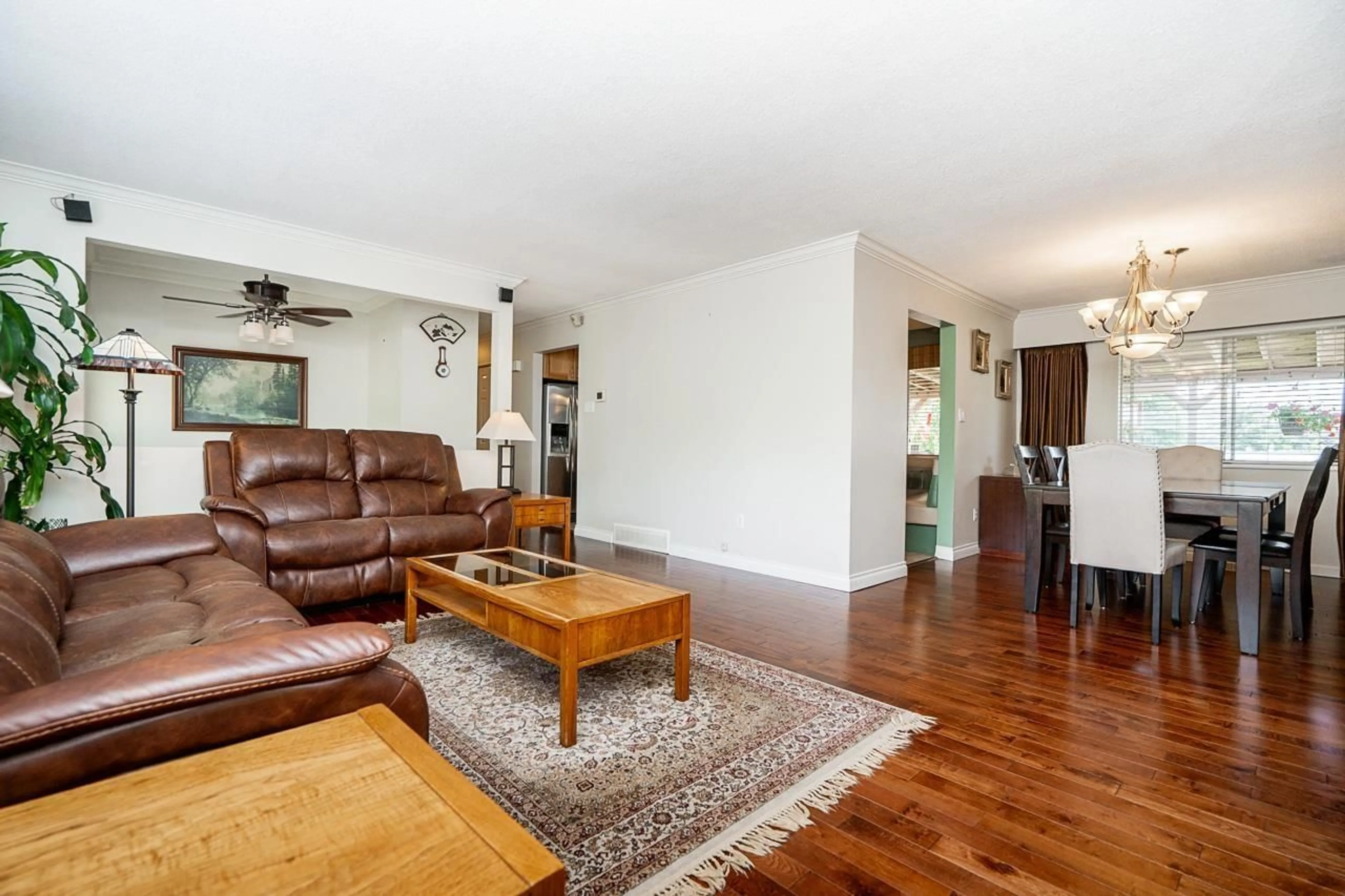 Living room with furniture, wood/laminate floor for 7159 114A STREET, Delta British Columbia V4E1X3