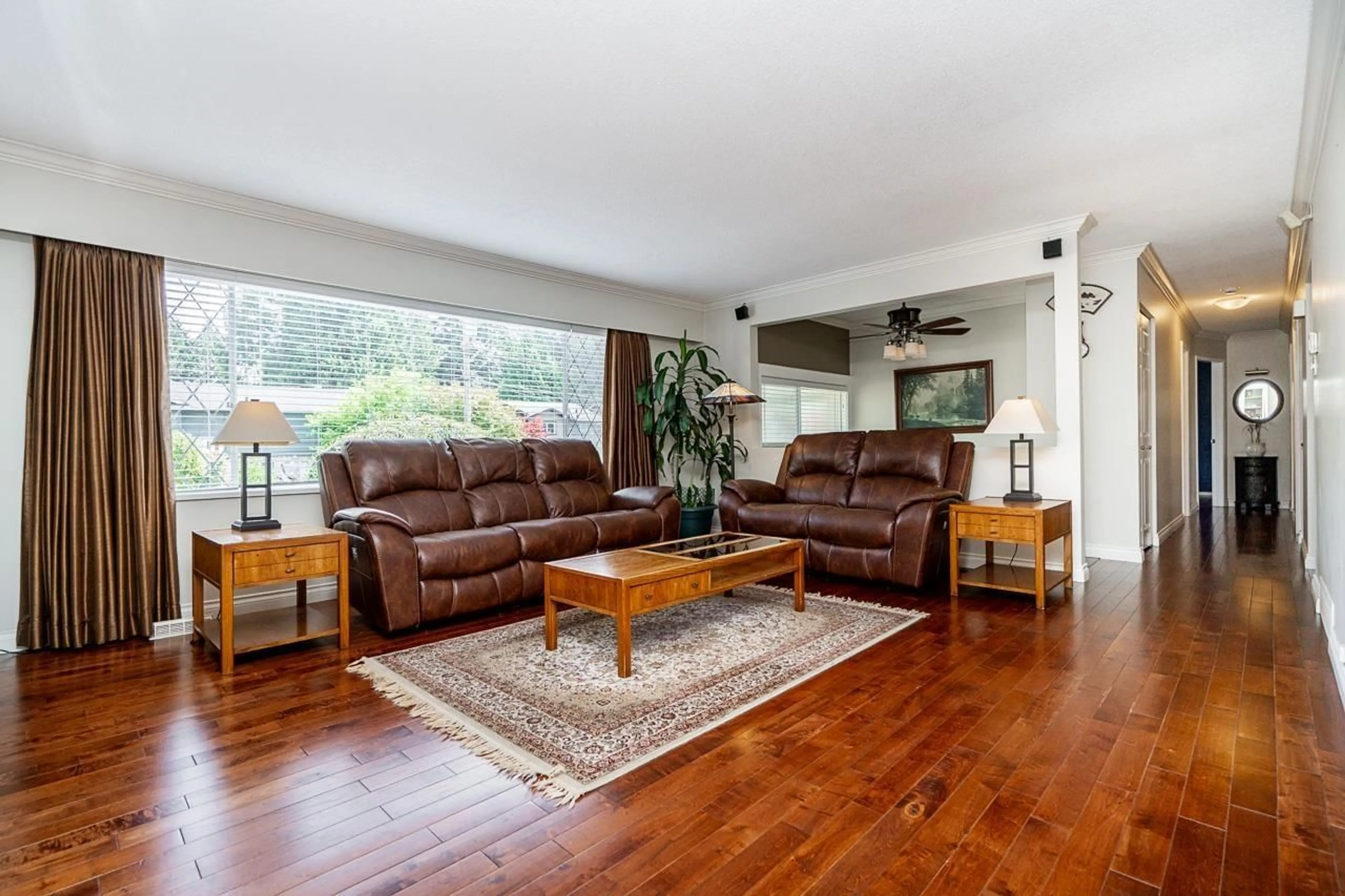 Living room with furniture, wood/laminate floor for 7159 114A STREET, Delta British Columbia V4E1X3