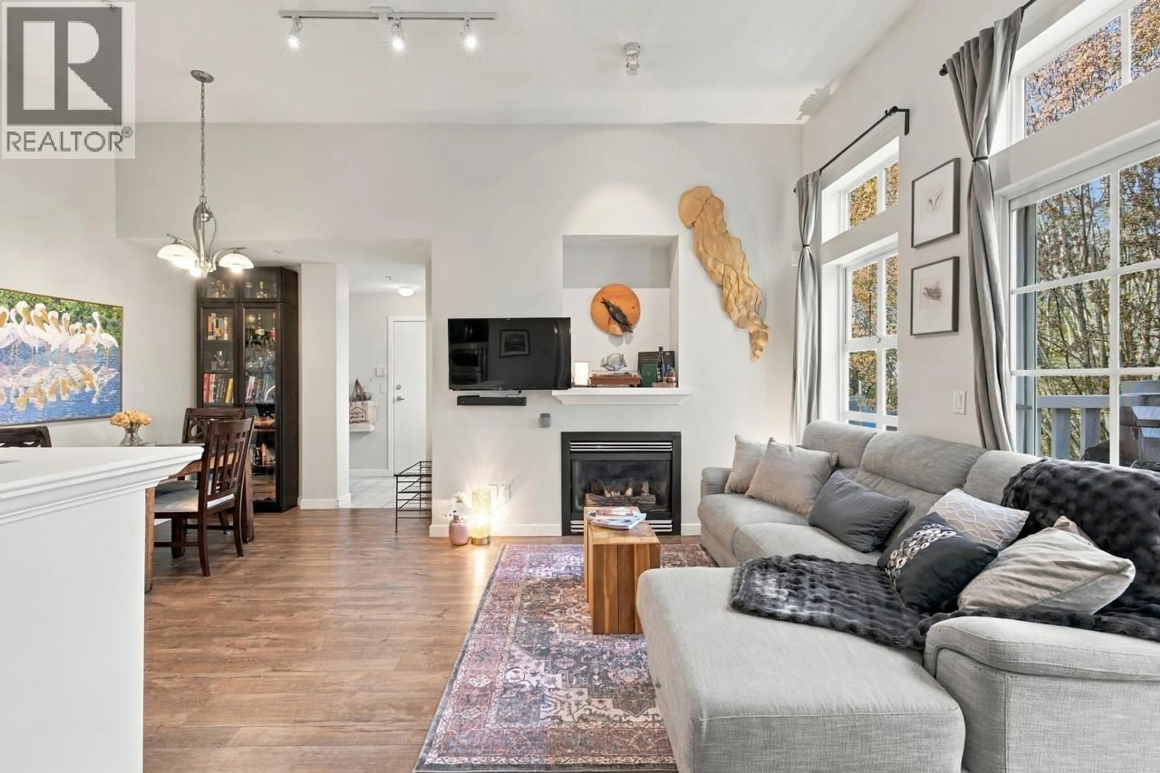Living room with furniture, unknown for 401 - 137 1ST STREET, North Vancouver British Columbia V7L1B2