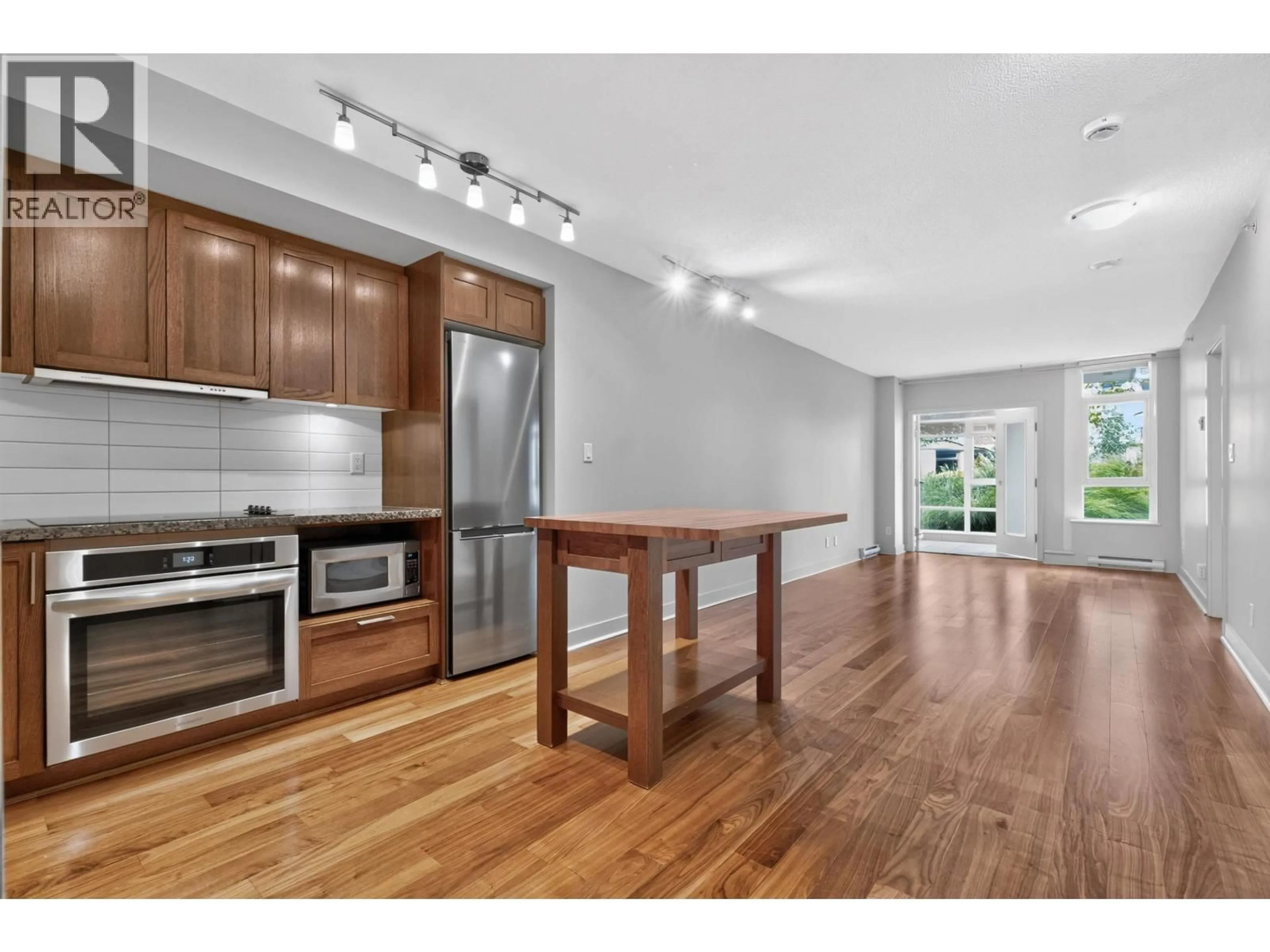 Open concept kitchen, wood/laminate floor for 314 - 2268 BROADWAY, Vancouver British Columbia V6K0B1