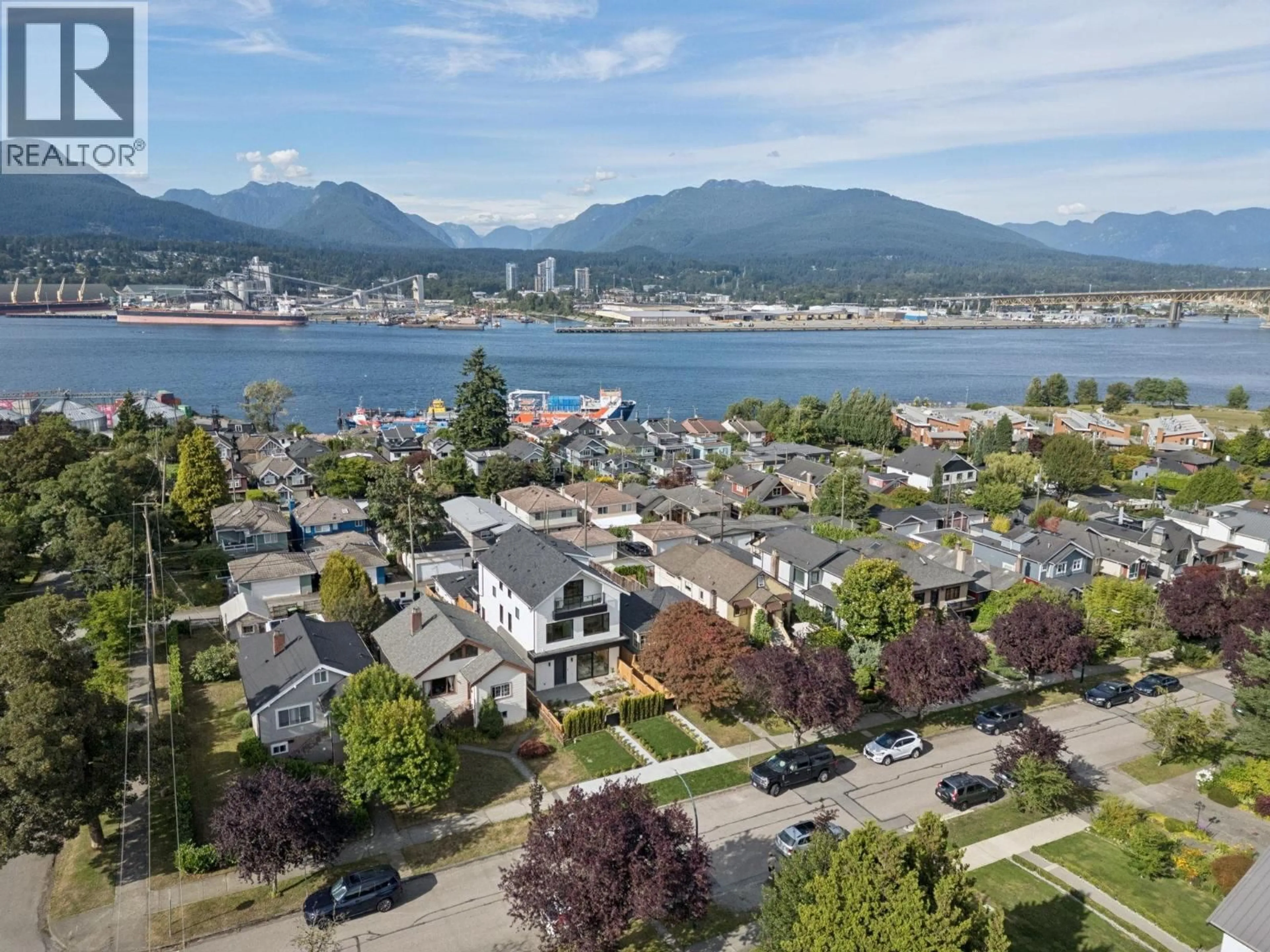 A pic from outside/outdoor area/front of a property/back of a property/a pic from drone, mountain view for 1 - 2815 TRINITY STREET, Vancouver British Columbia V5K1E8