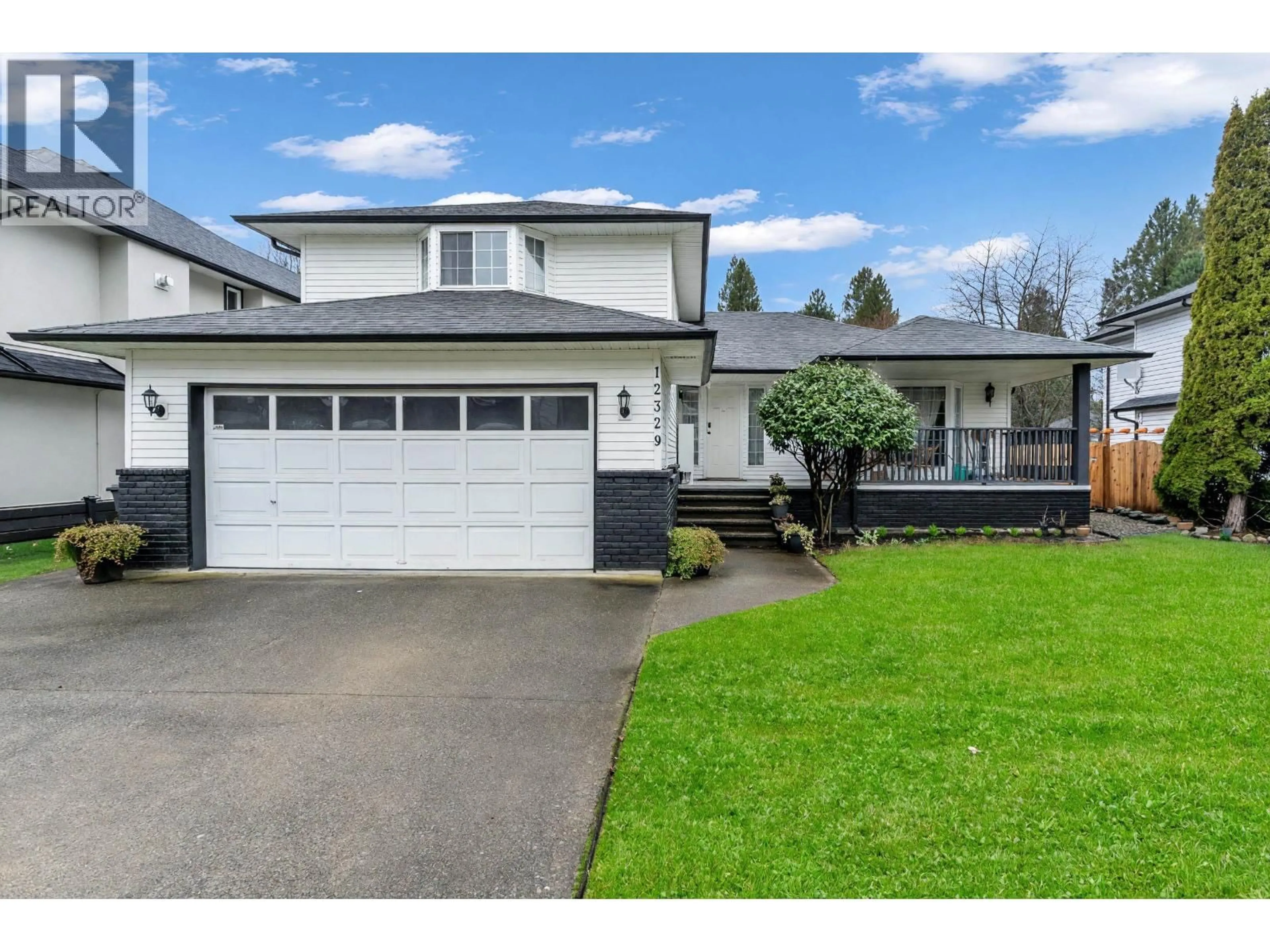 Home with vinyl exterior material, street for 12329 BONSON ROAD, Pitt Meadows British Columbia V3Y1B1