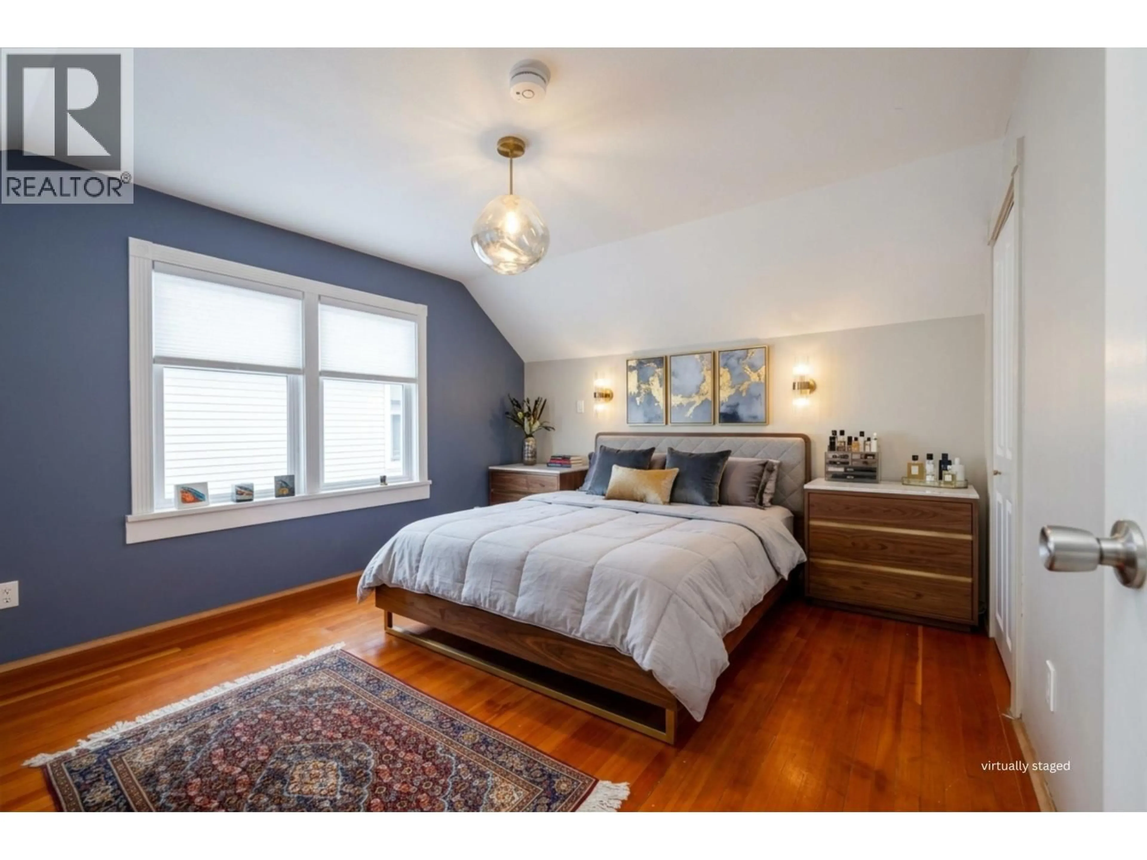 Bedroom with bed, wood/laminate floor for 4343 11TH AVENUE, Vancouver British Columbia V6R2L9