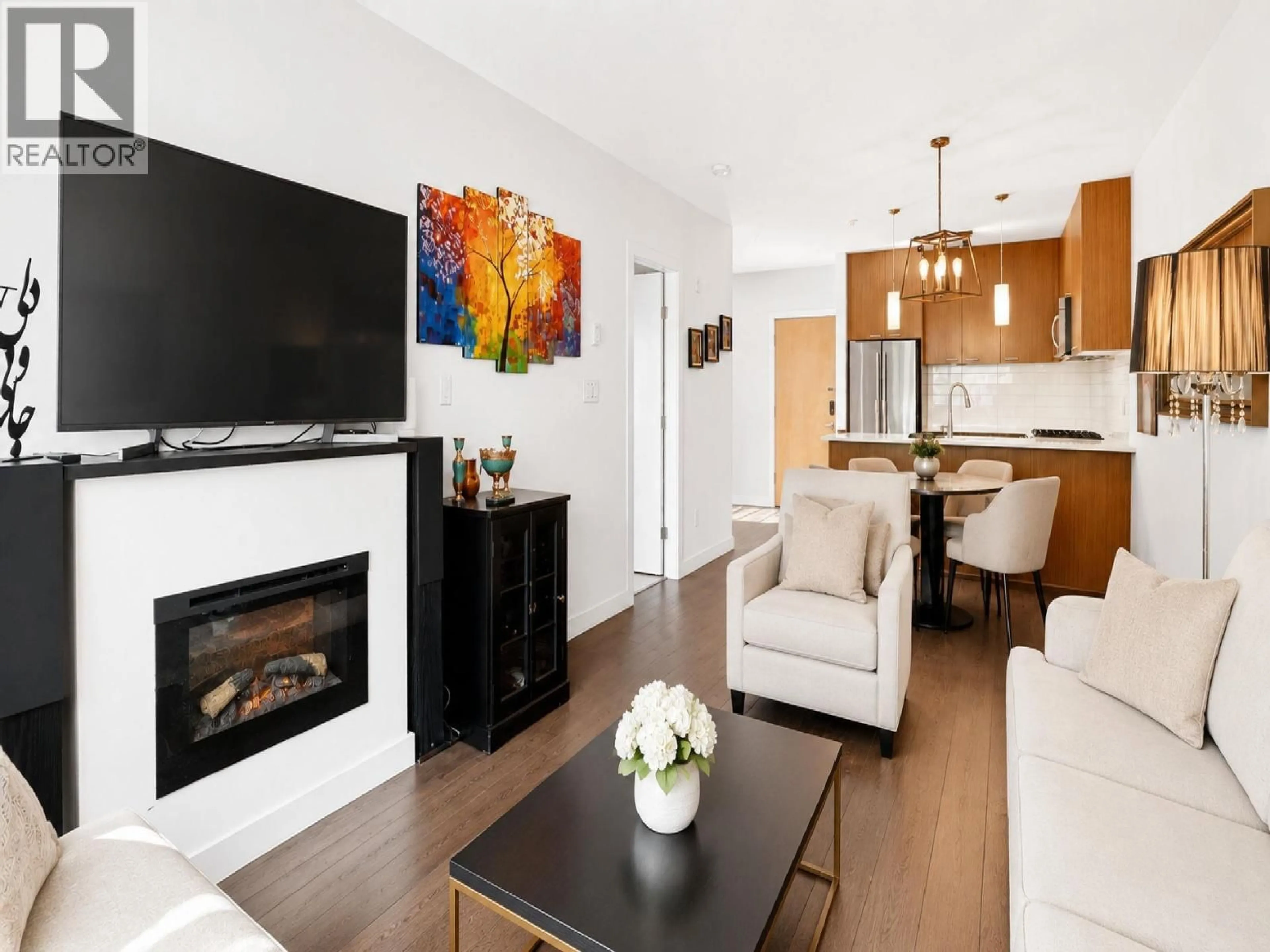 Living room with furniture, wood/laminate floor for 201 - 1330 MARINE DRIVE, North Vancouver British Columbia V7P1T4