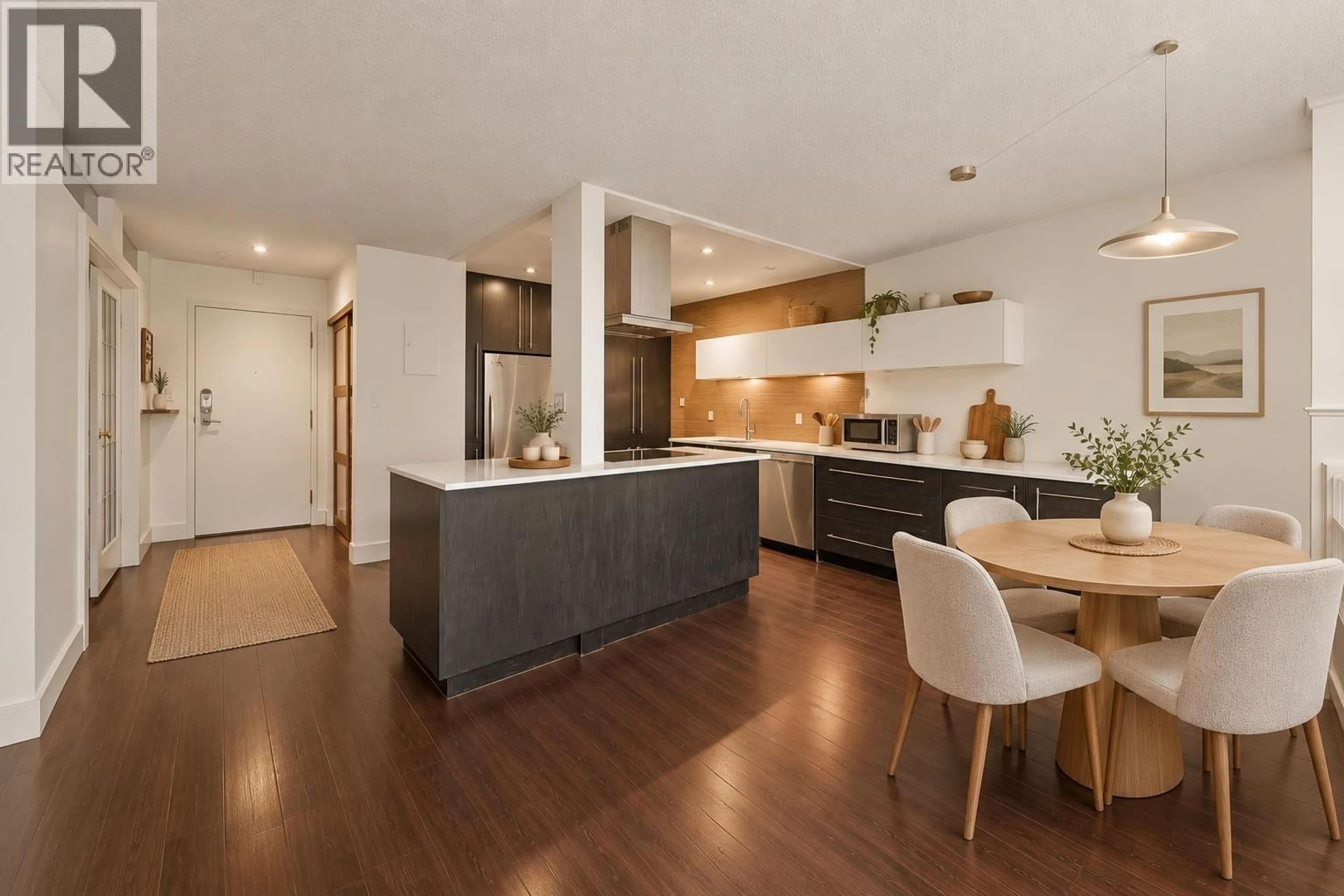 Open concept kitchen, wood/laminate floor for 304 - 141 13TH STREET, North Vancouver British Columbia V7M1N5