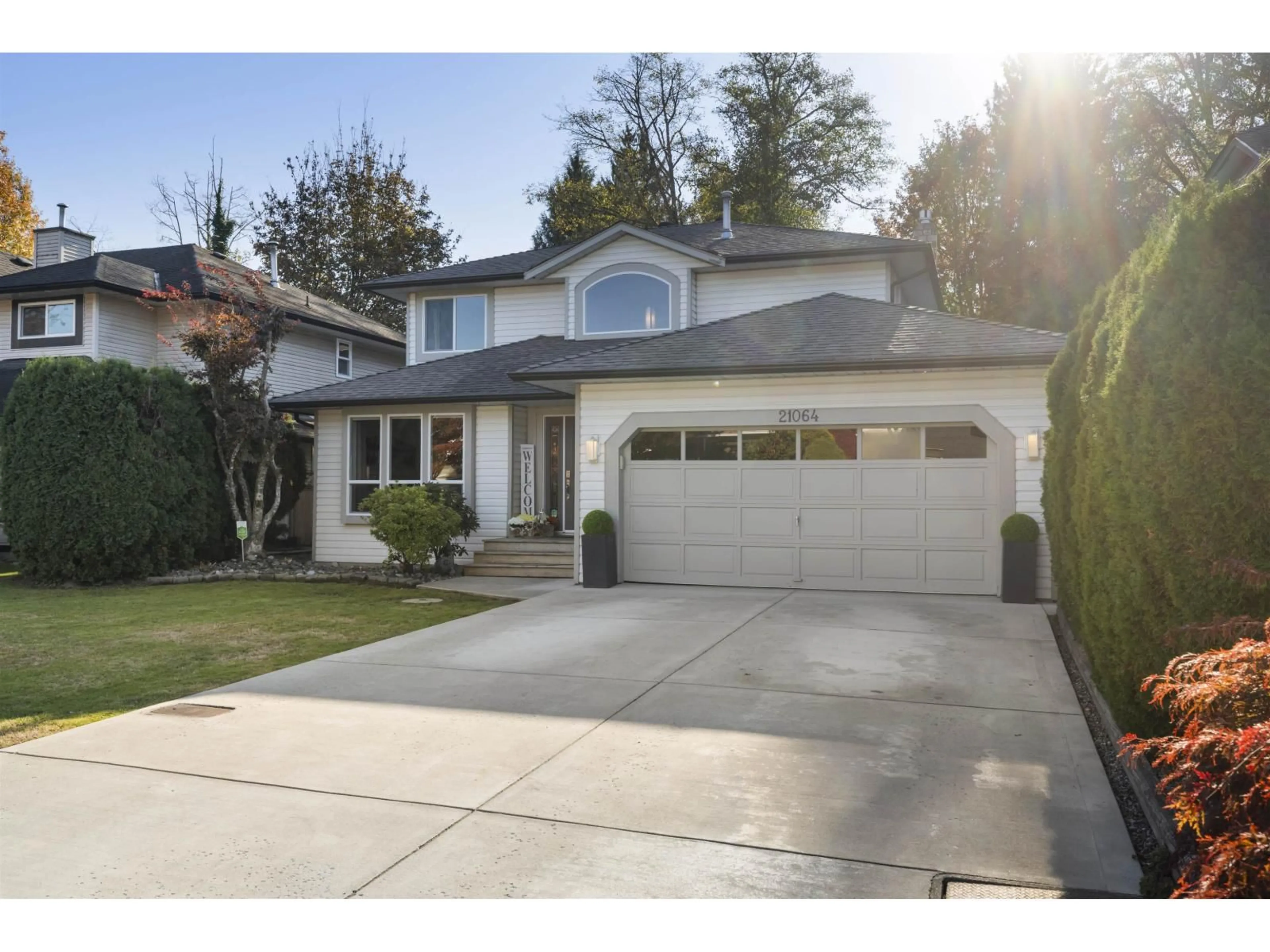Home with vinyl exterior material, street for 21064 91A AVENUE, Langley British Columbia V1M2C4