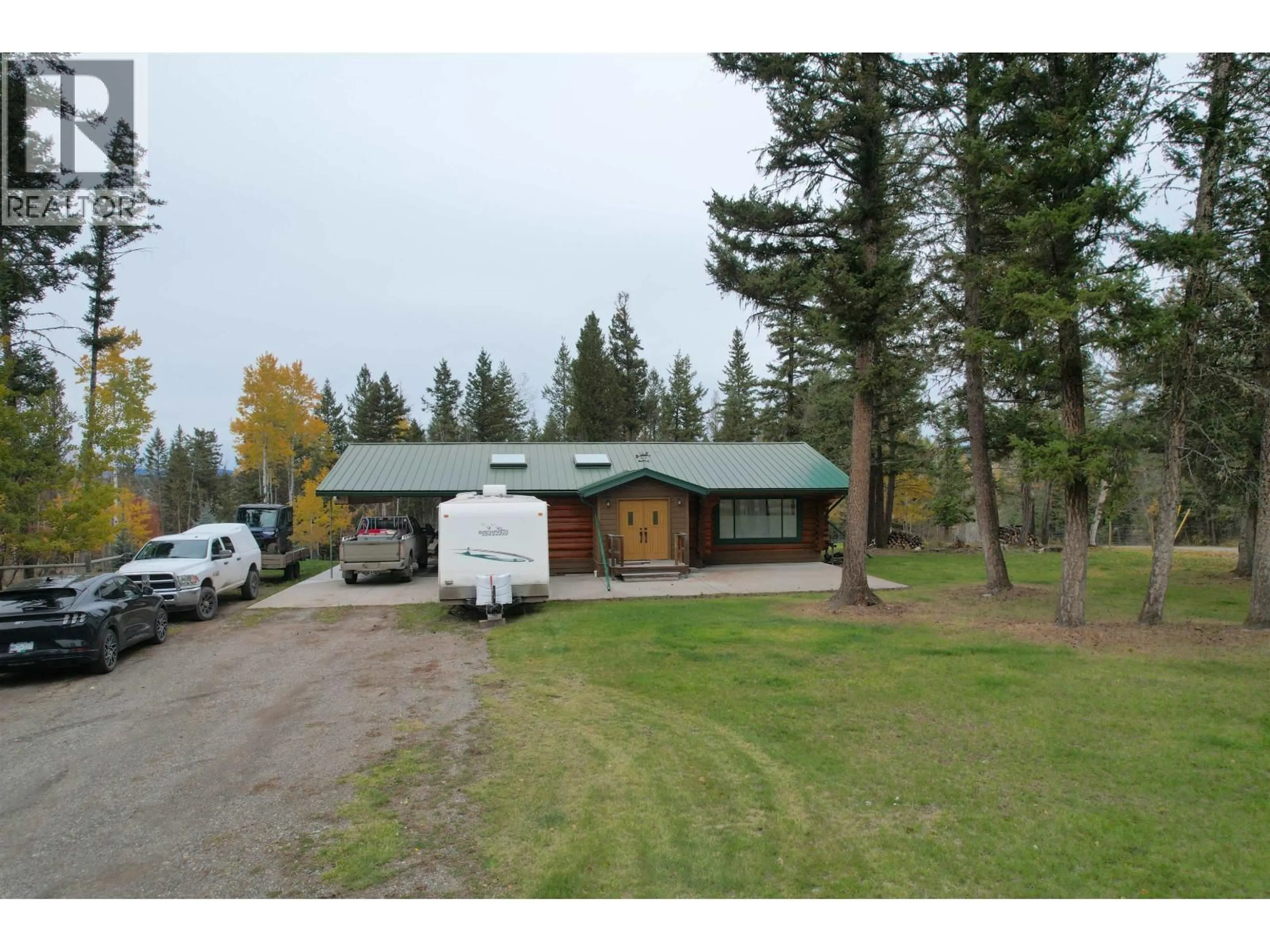 A pic from outside/outdoor area/front of a property/back of a property/a pic from drone, unknown for 5361 QUA PLACE, 108 Mile Ranch British Columbia V0K2Z0