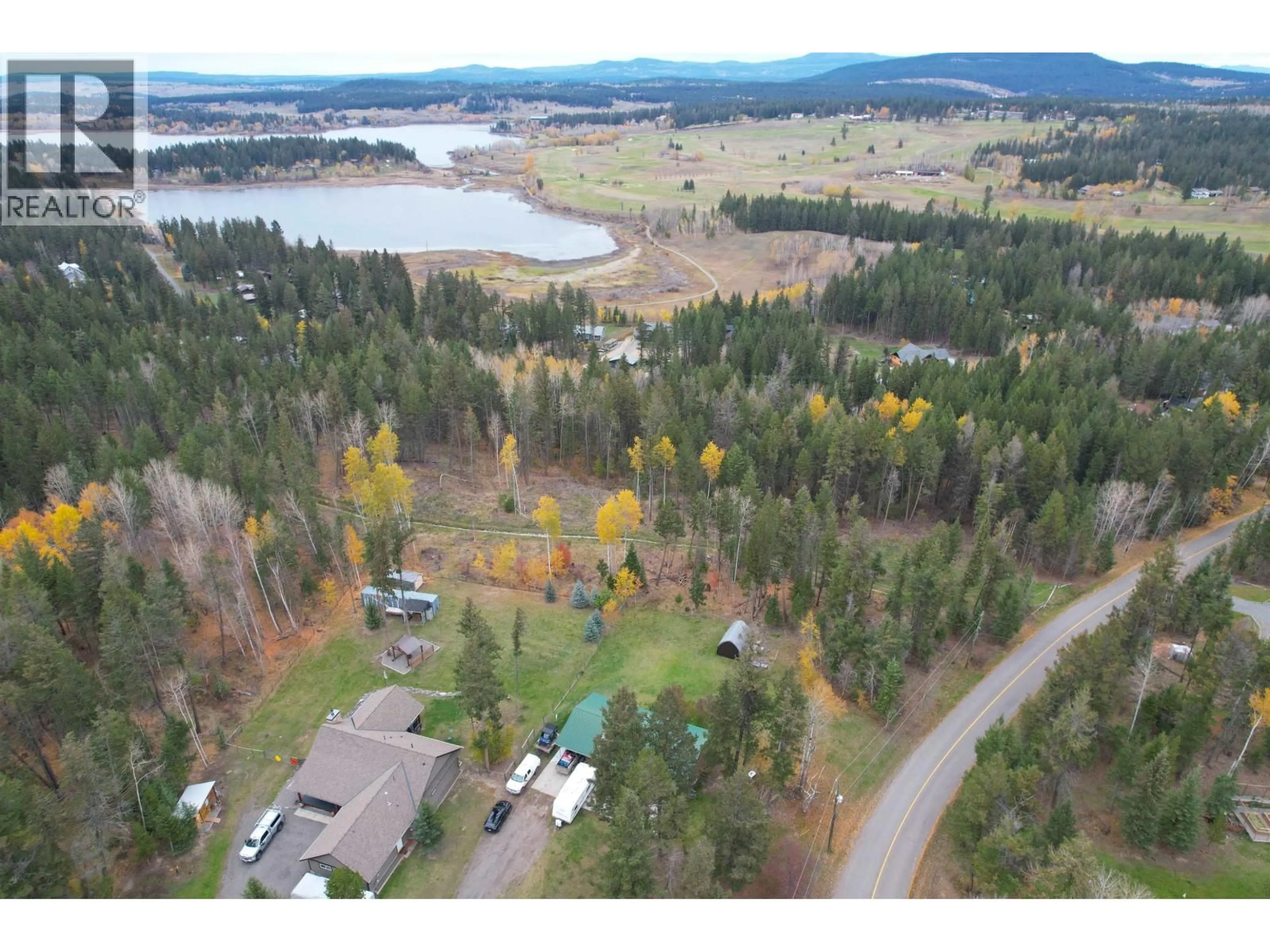 A pic from outside/outdoor area/front of a property/back of a property/a pic from drone, water/lake/river/ocean view for 5361 QUA PLACE, 108 Mile Ranch British Columbia V0K2Z0
