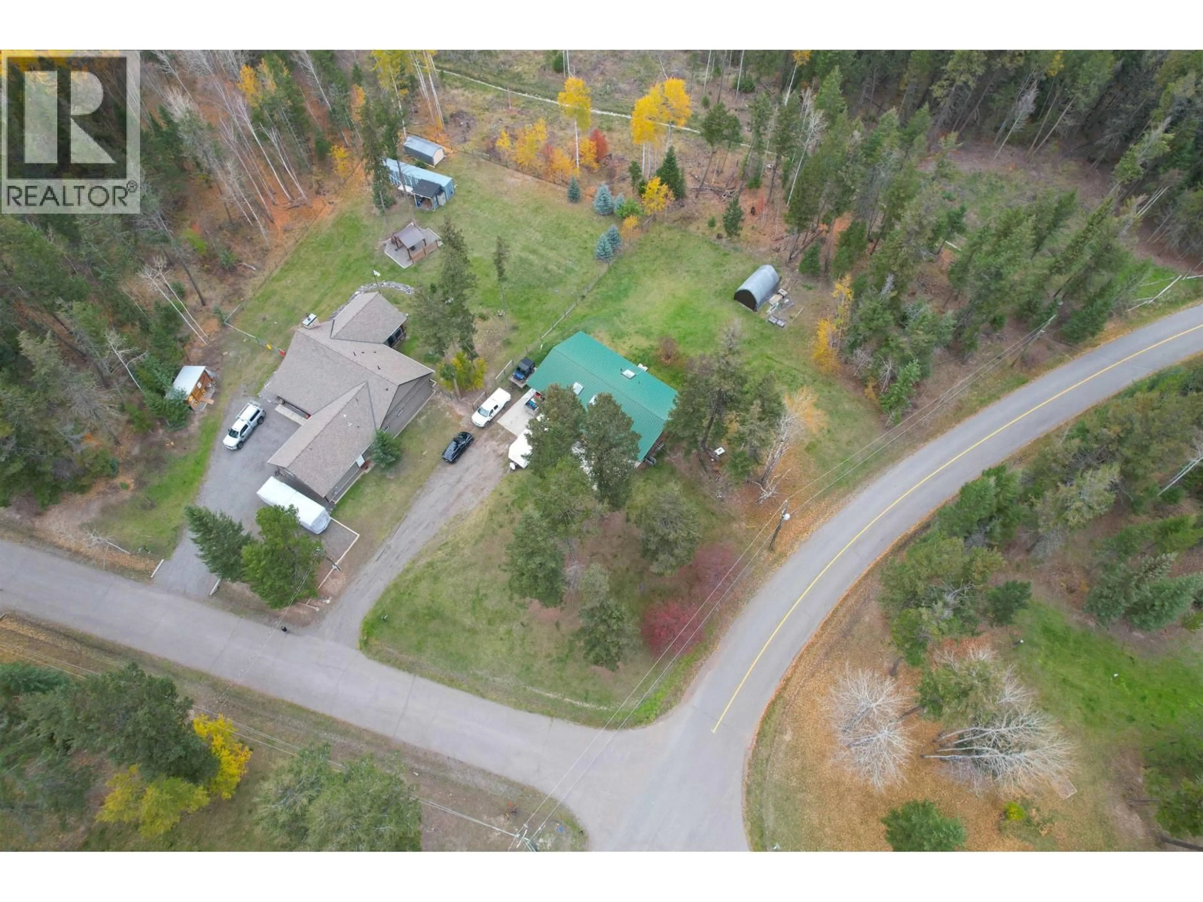A pic from outside/outdoor area/front of a property/back of a property/a pic from drone, forest/trees view for 5361 QUA PLACE, 108 Mile Ranch British Columbia V0K2Z0