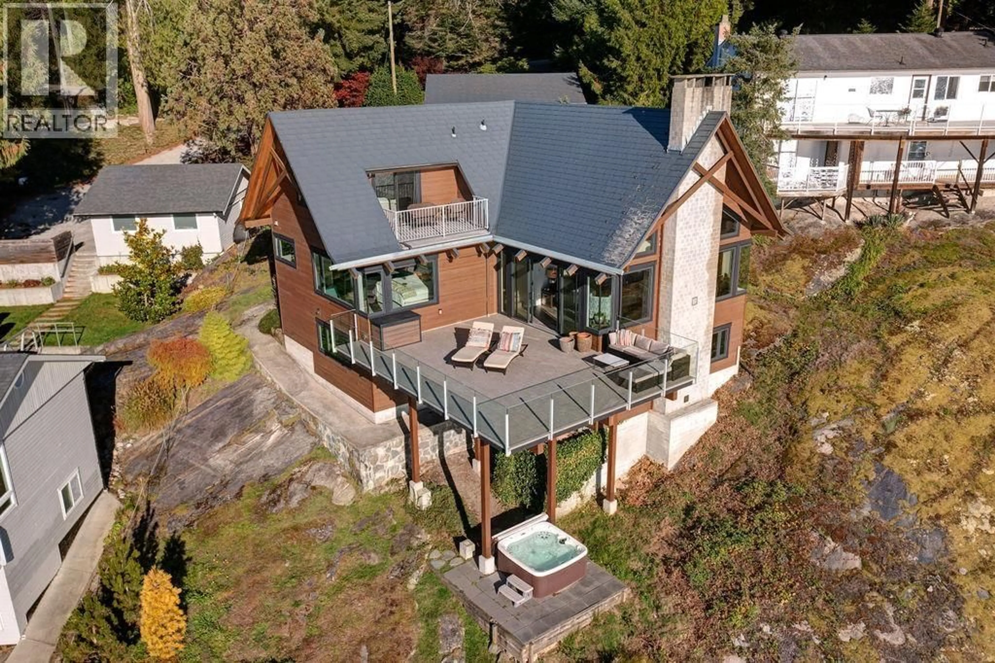A pic from outside/outdoor area/front of a property/back of a property/a pic from drone, building for 8327 REDROOFFS ROAD, Sechelt British Columbia V7Z1E4