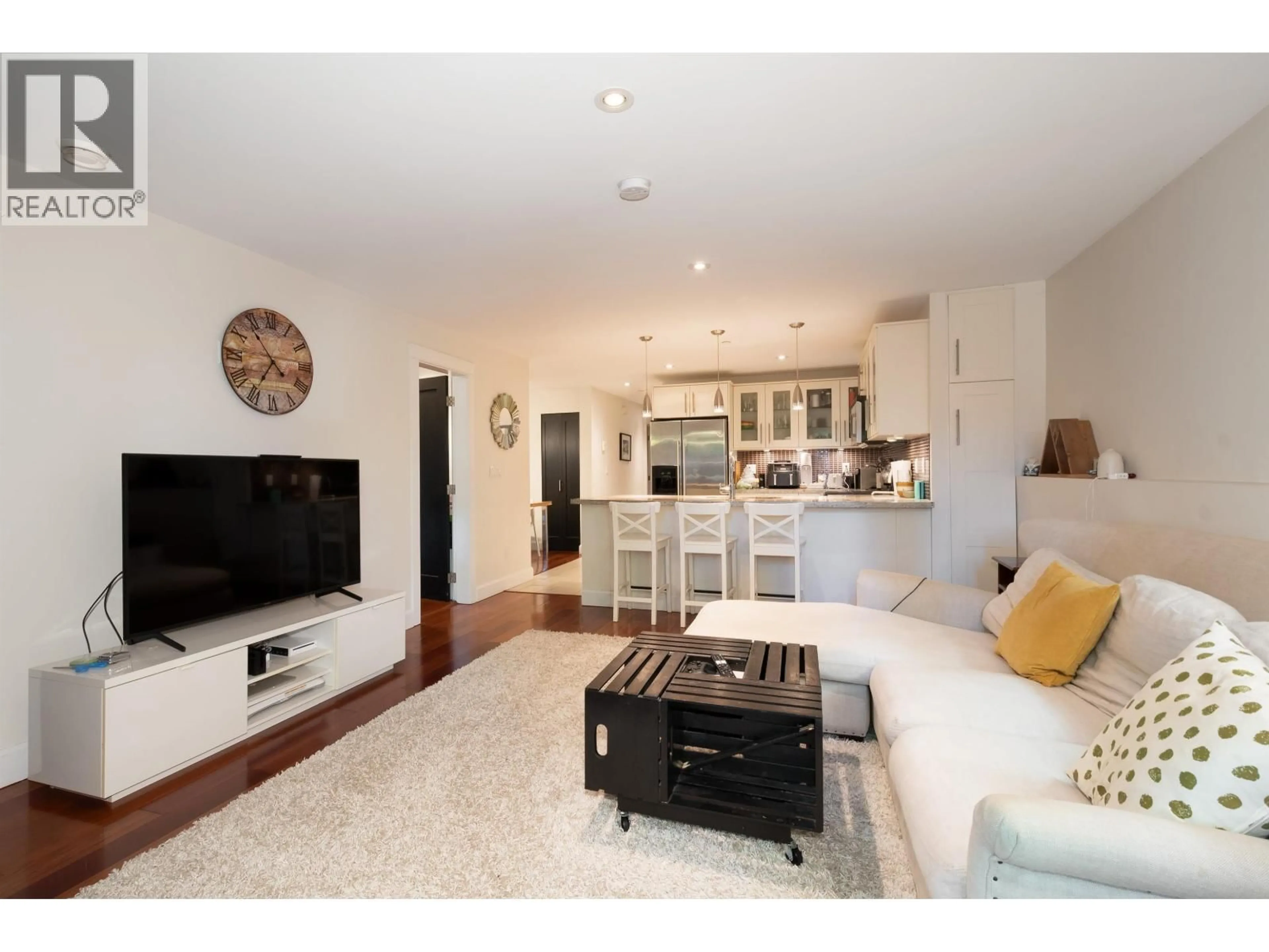 Living room with furniture, wood/laminate floor for 1931 7TH AVENUE, Vancouver British Columbia V5N1S3