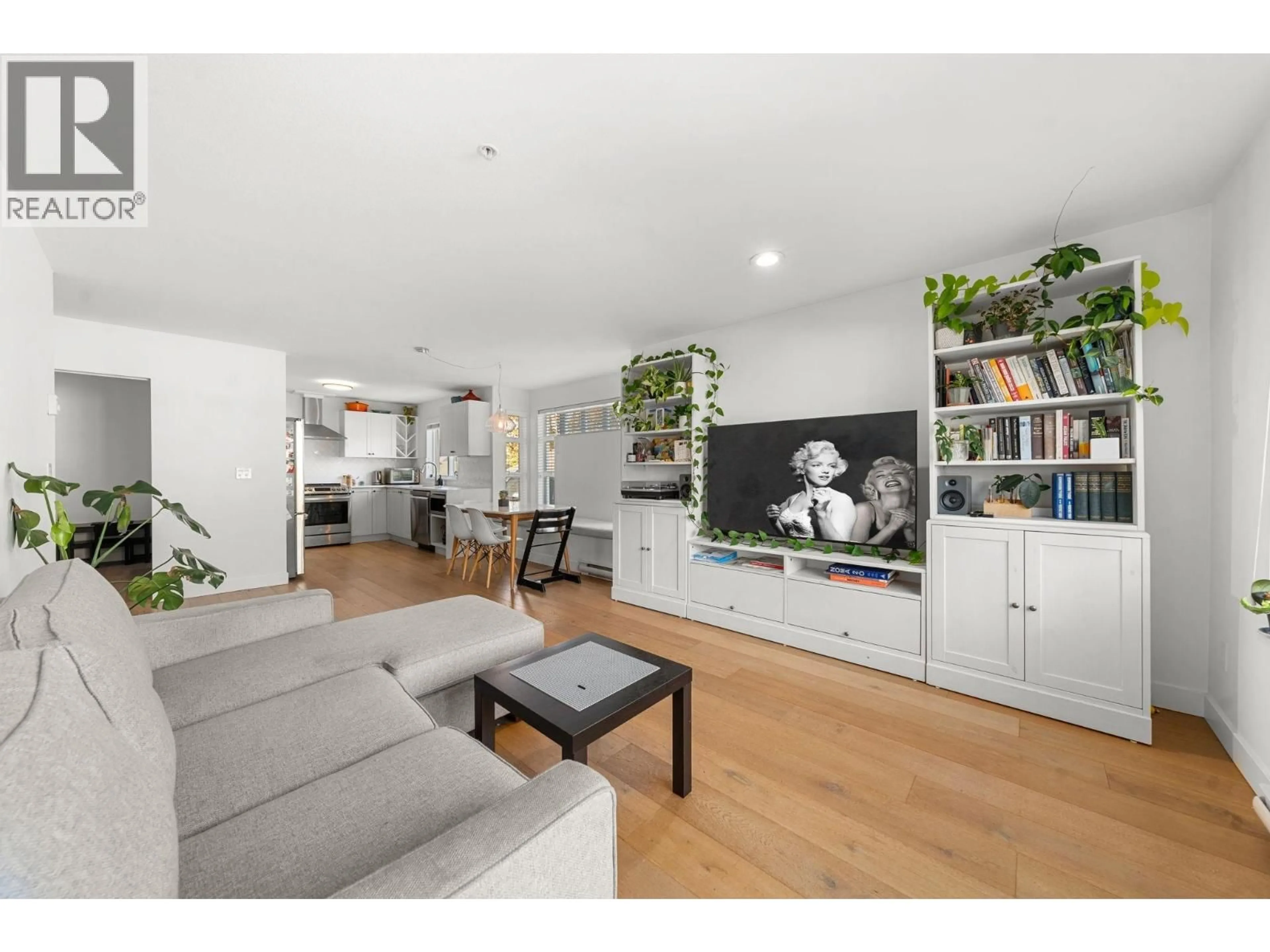 Living room with furniture, wood/laminate floor for 207 - 183 23RD STREET, North Vancouver British Columbia V7M2B1