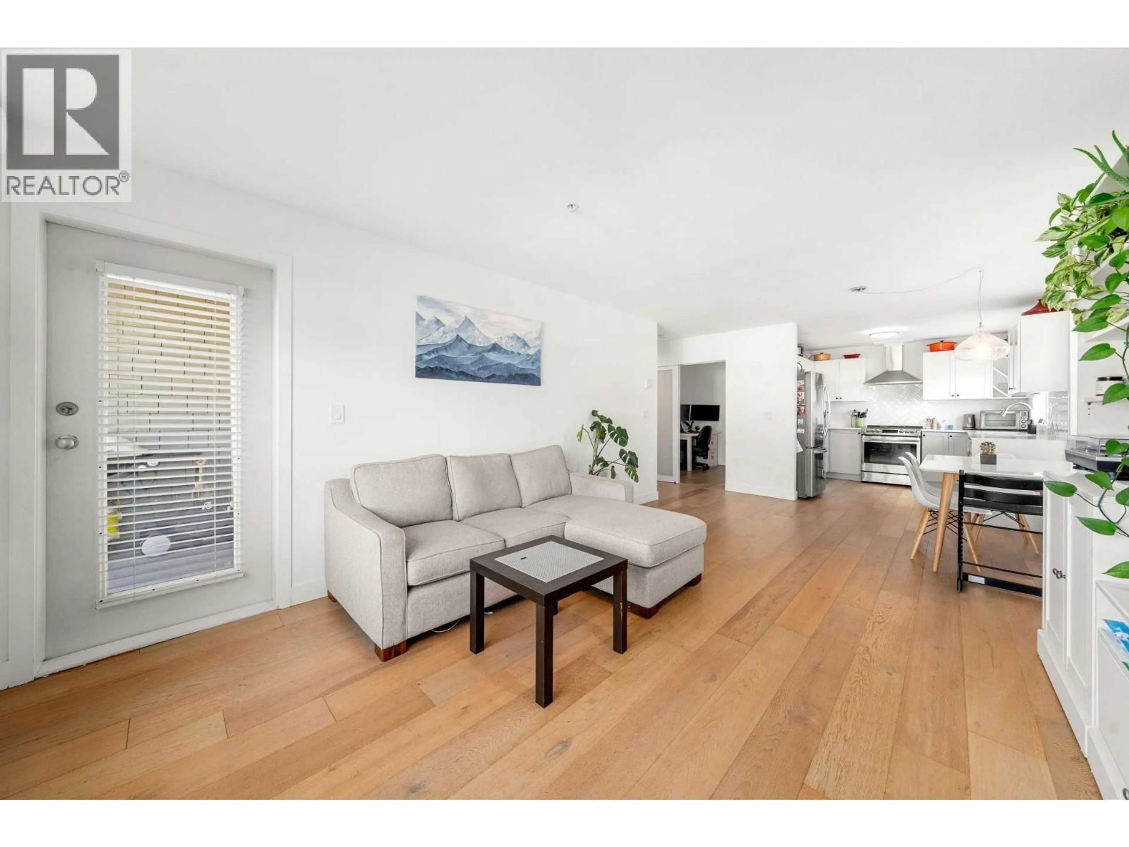Living room with furniture, wood/laminate floor for 207 - 183 23RD STREET, North Vancouver British Columbia V7M2B1
