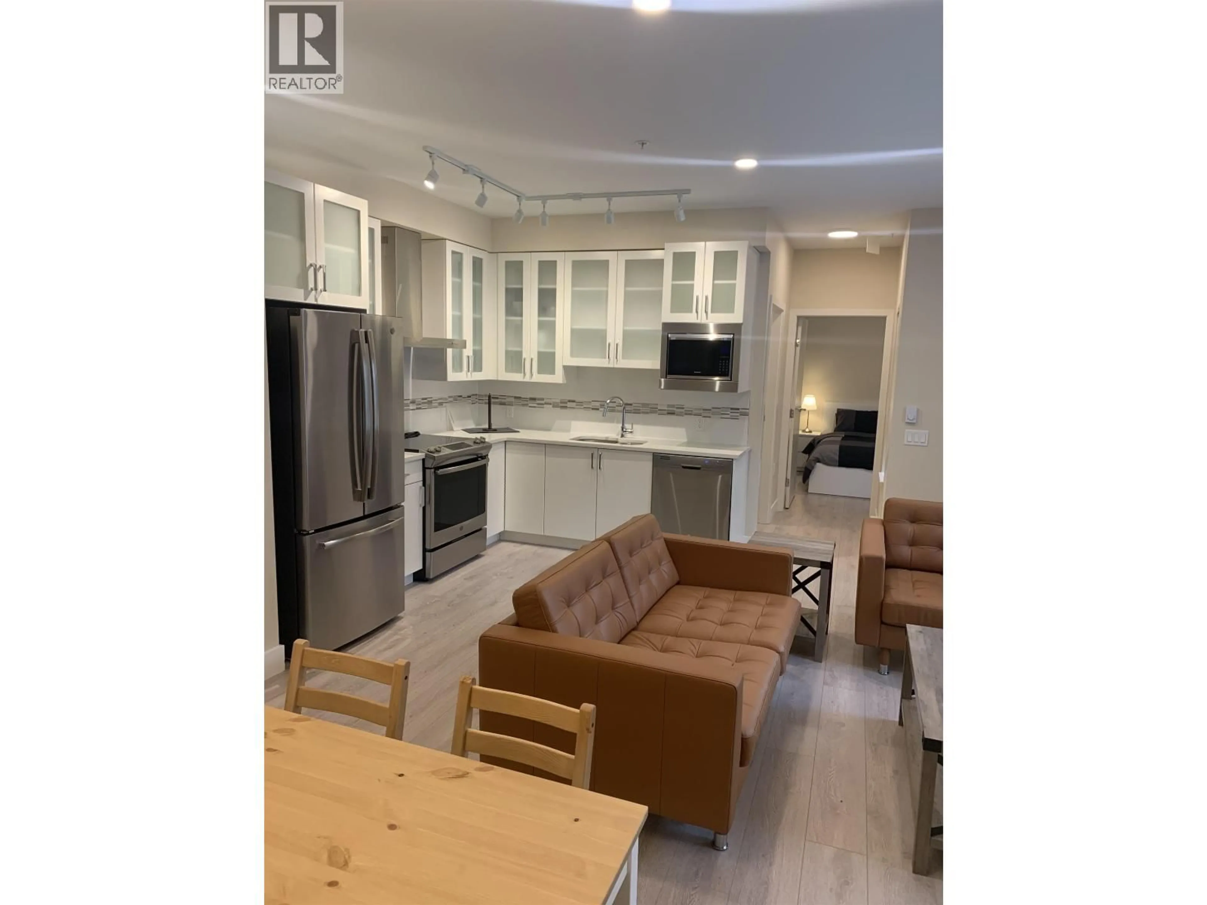 Open concept kitchen, wood/laminate floor for 206 - 4882 SLOCAN STREET, Vancouver British Columbia V5R2A3