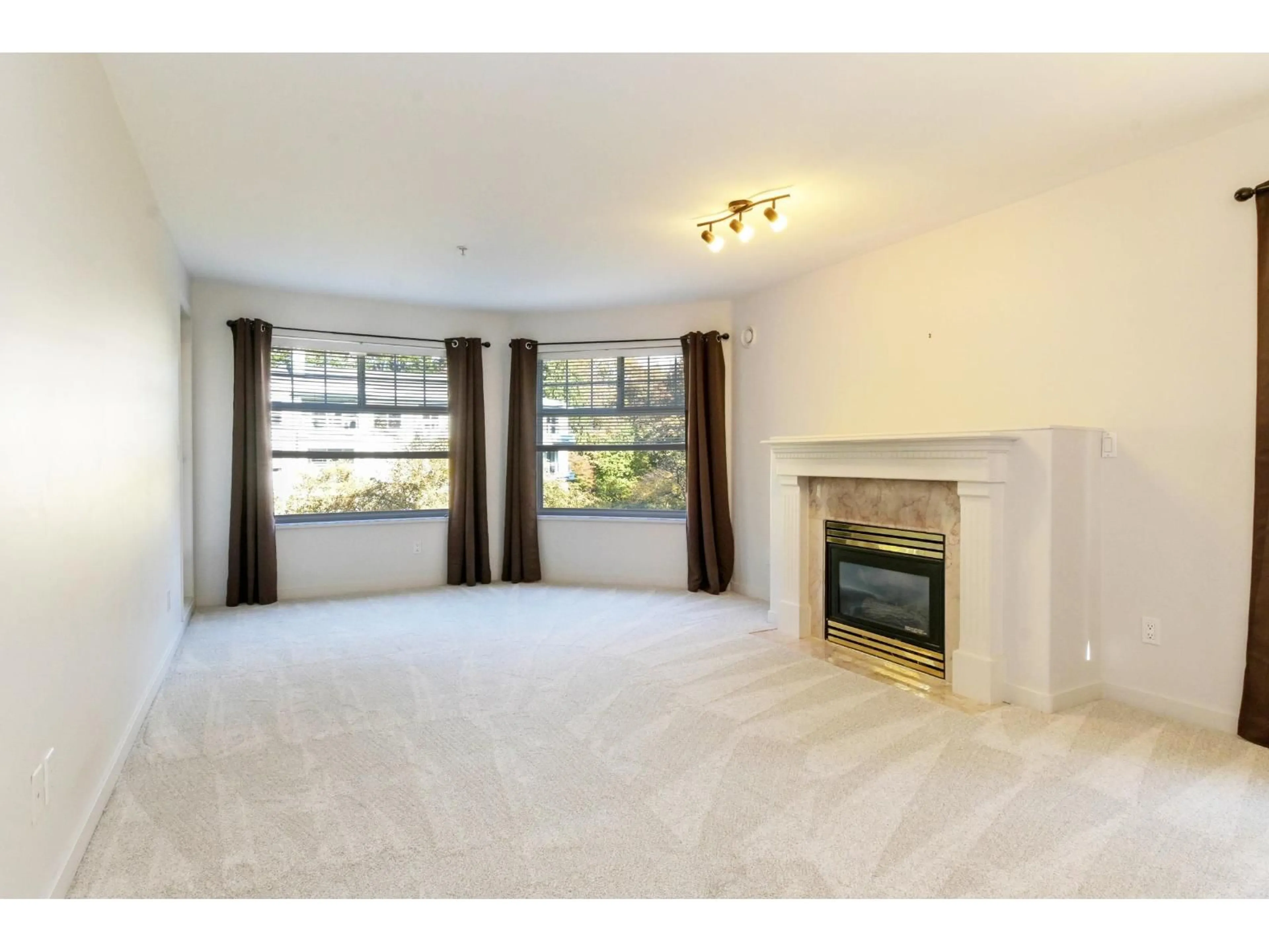 Living room with furniture, carpet floor for 203 - 8976 208 STREET, Langley British Columbia V1M2Y8