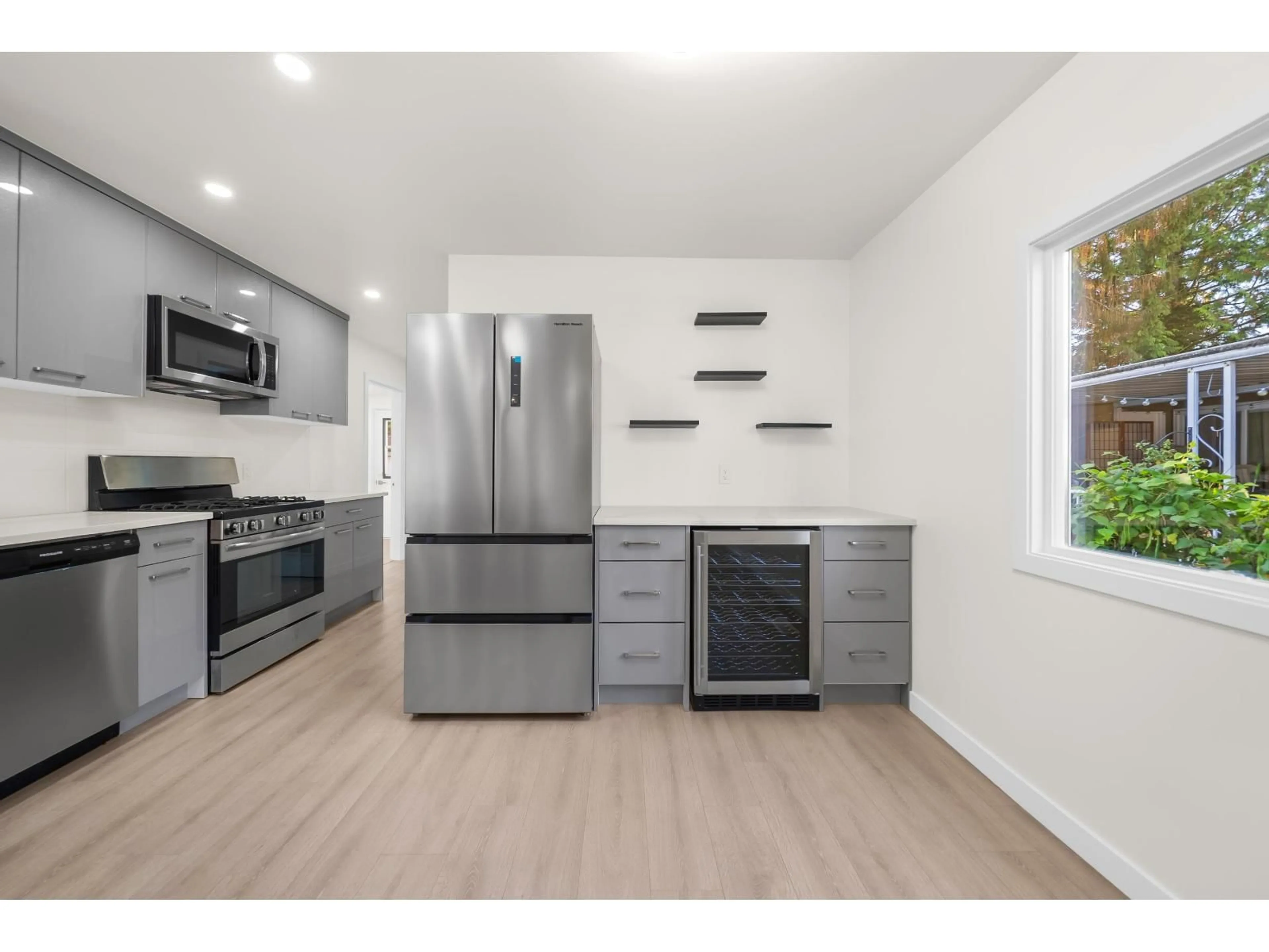 Open concept kitchen, wood/laminate floor for 337 - 1840 160 STREET, Surrey British Columbia V4A4X4