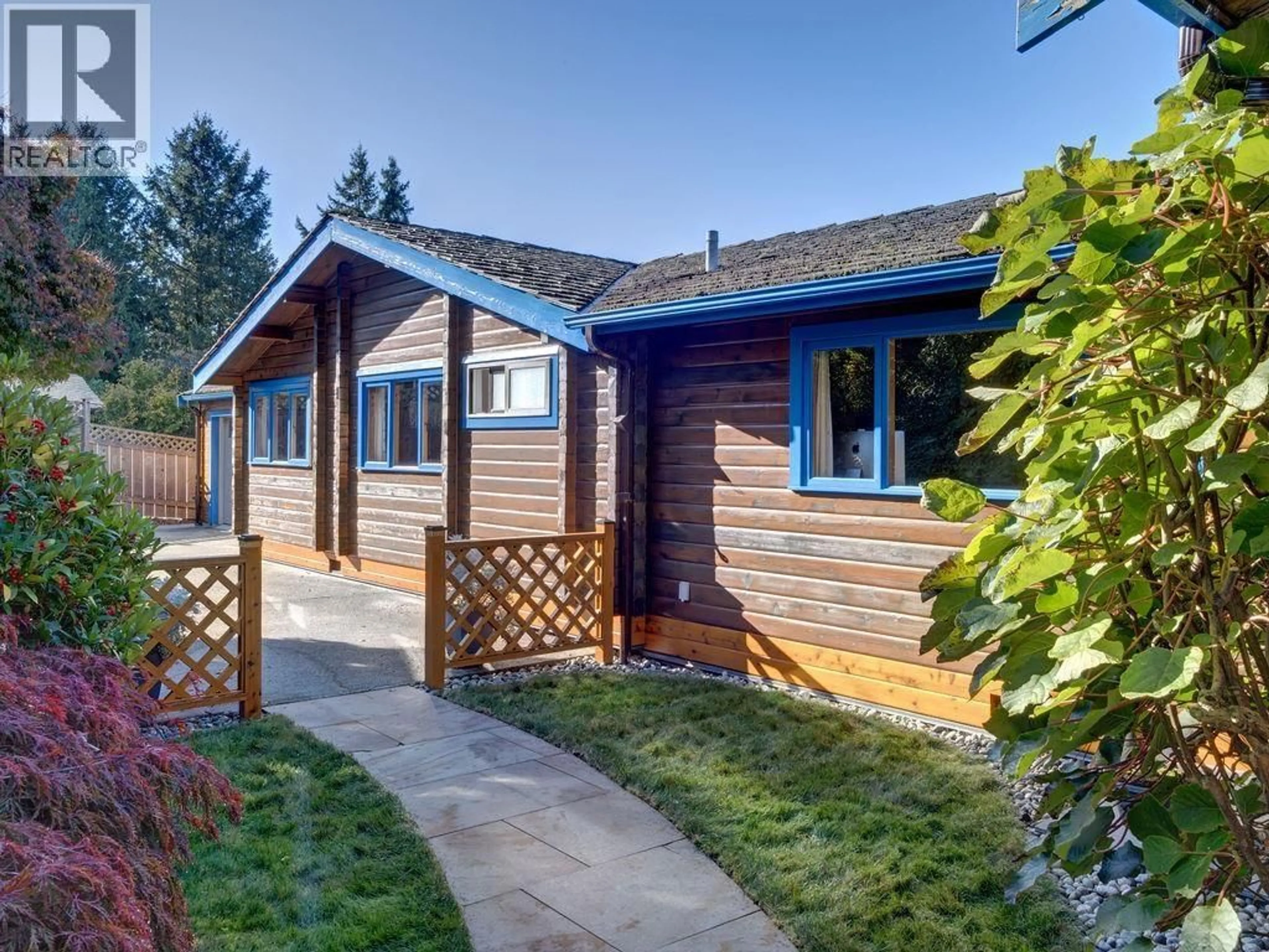 Home with vinyl exterior material, street for 5229 YACHT ROAD, Sechelt British Columbia V7Z0C1