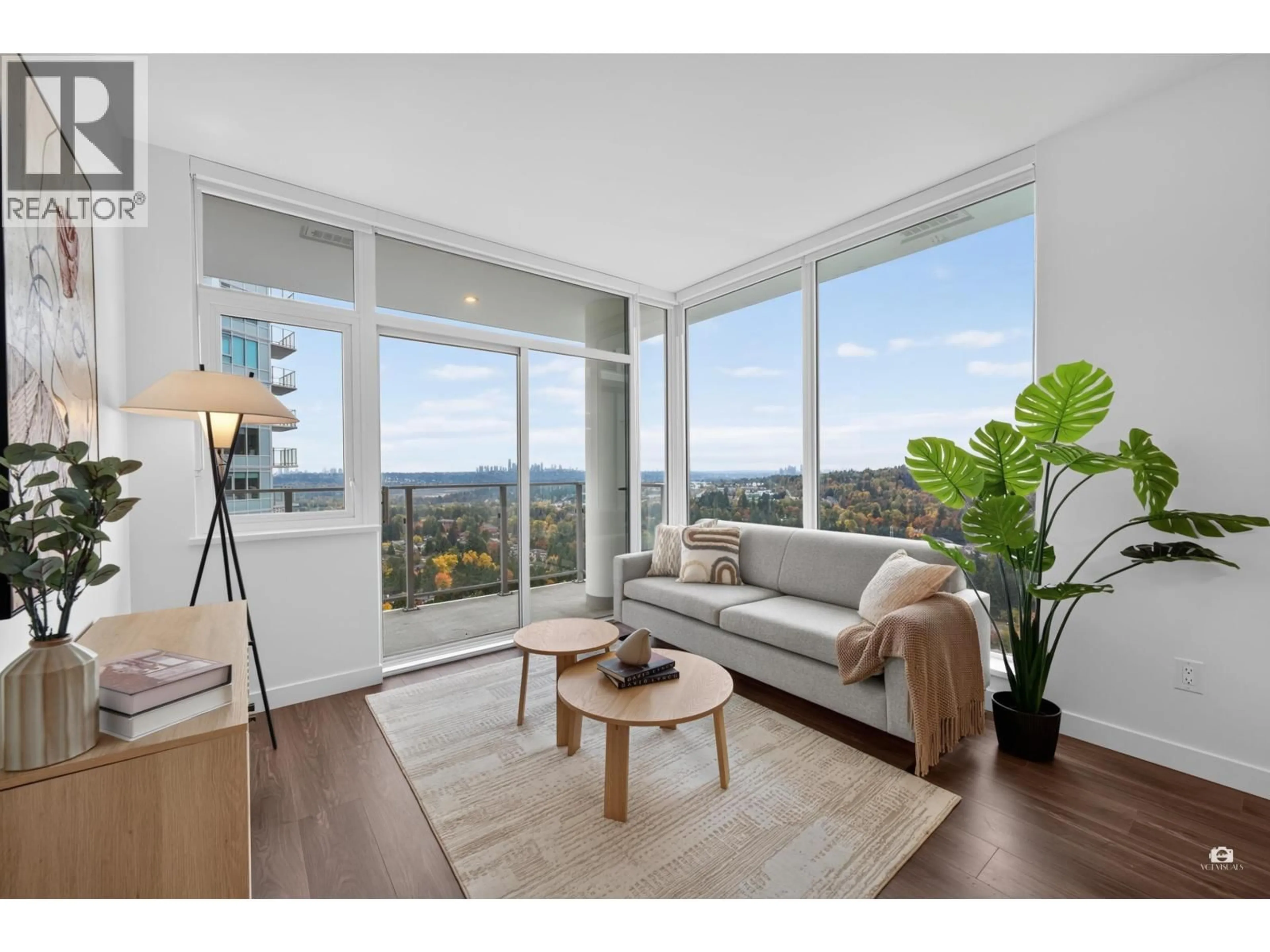 Living room with furniture, wood/laminate floor for 2207 - 518 CLARKE ROAD, Coquitlam British Columbia V3J3X2