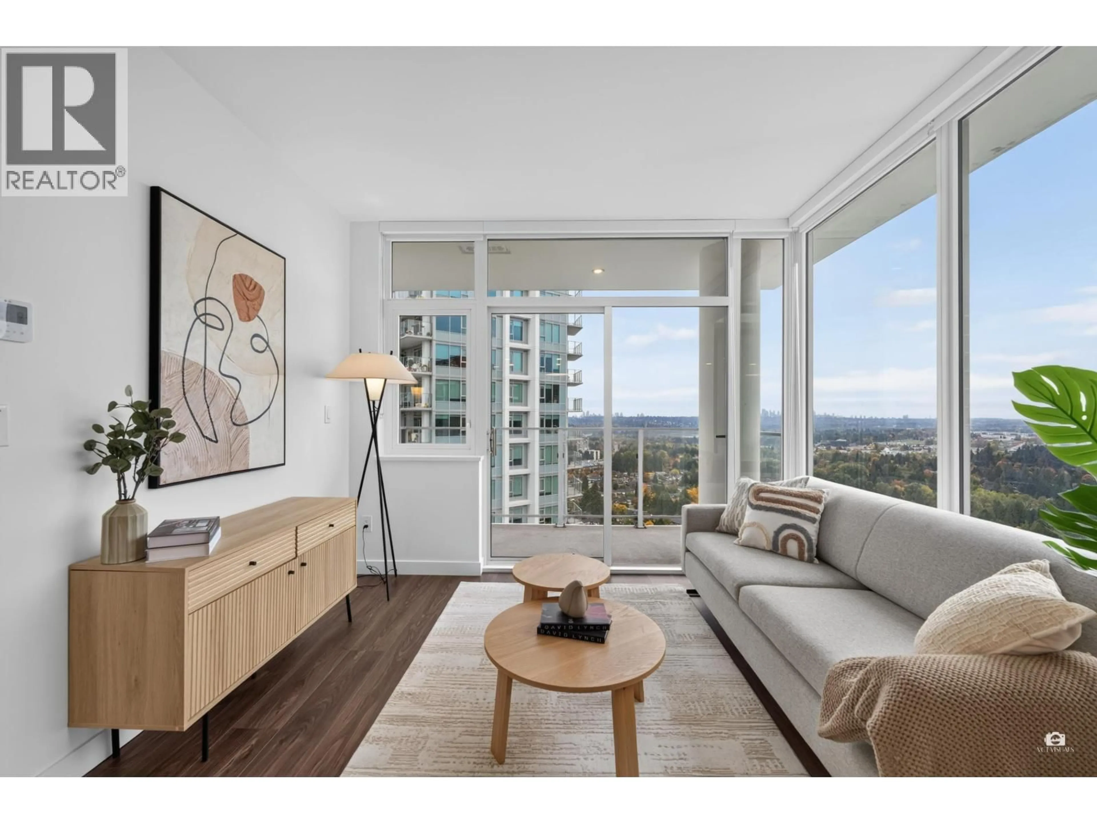 Living room with furniture, wood/laminate floor for 2207 - 518 CLARKE ROAD, Coquitlam British Columbia V3J3X2