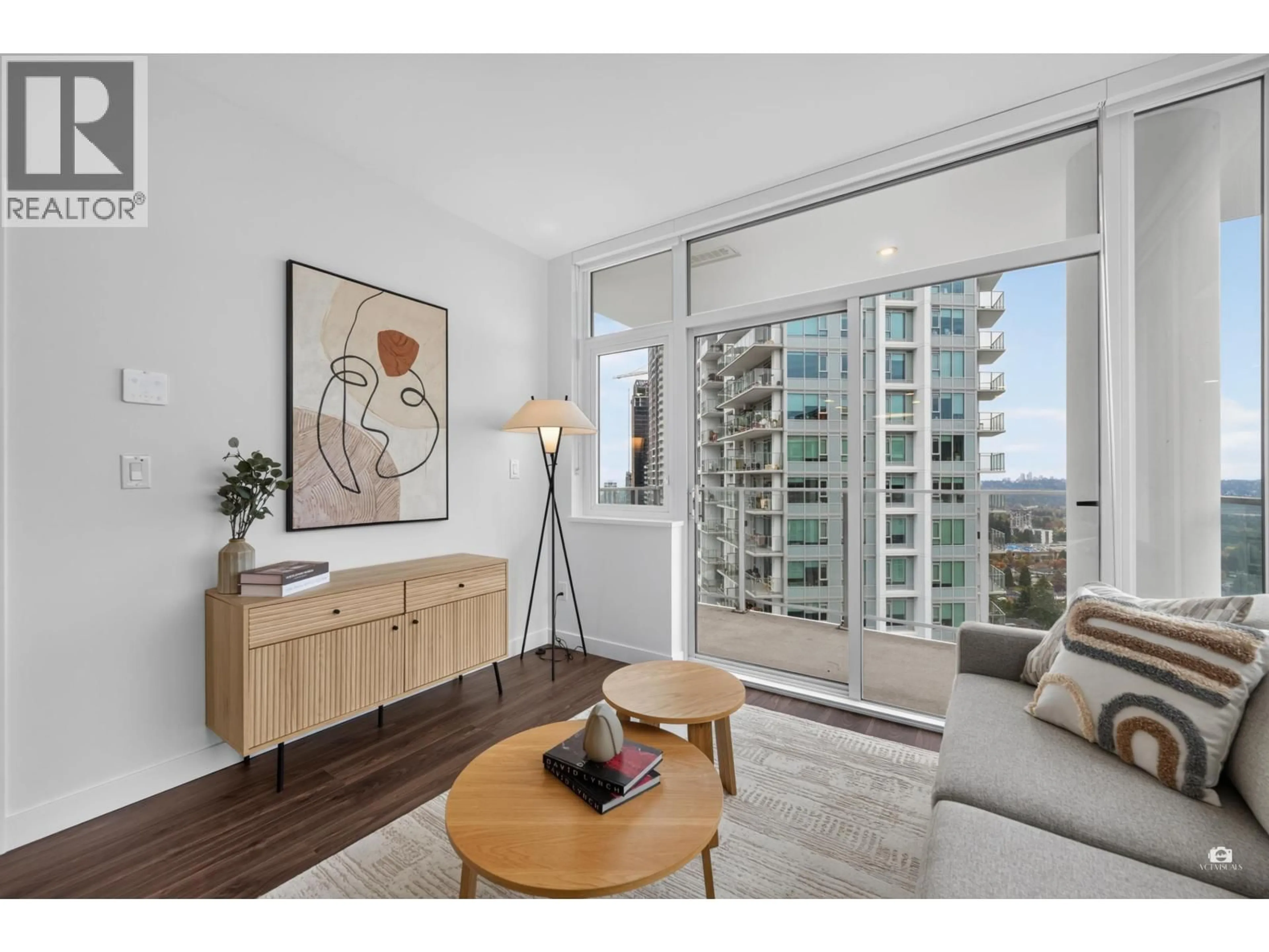 Living room with furniture, wood/laminate floor for 2207 - 518 CLARKE ROAD, Coquitlam British Columbia V3J3X2