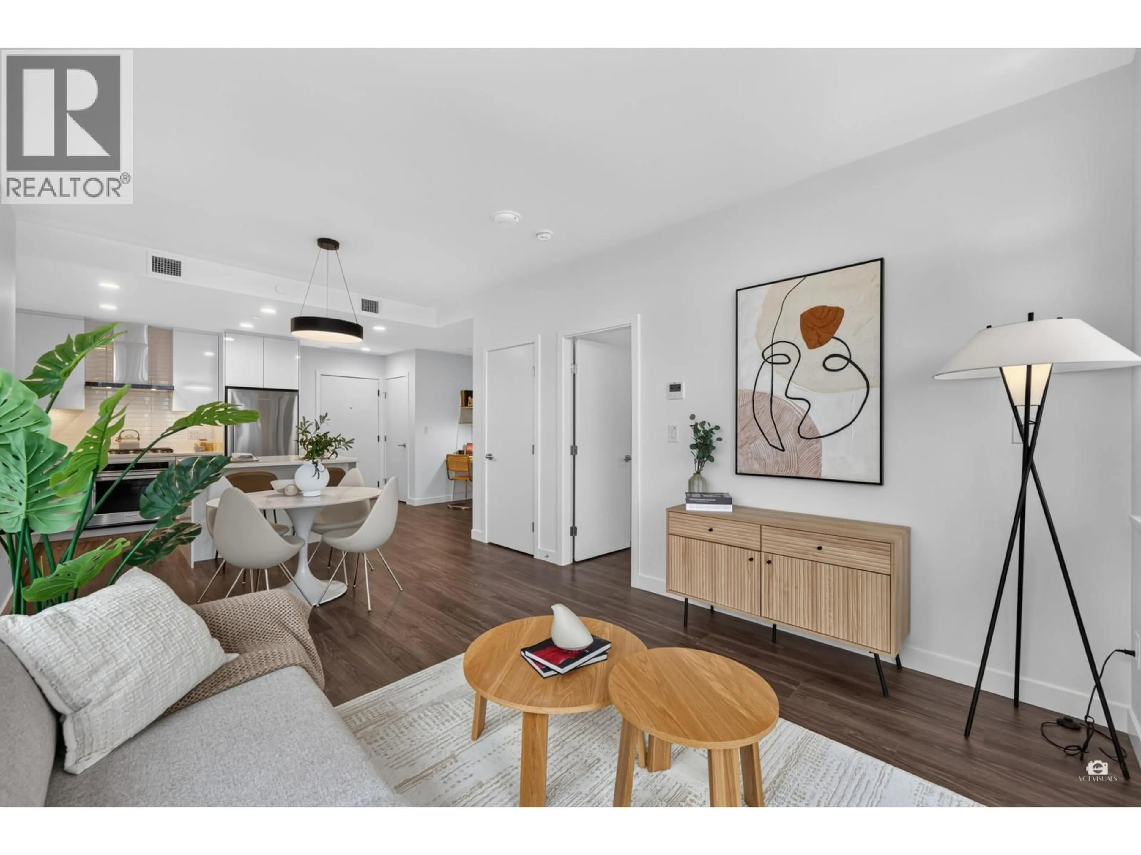 Living room with furniture, wood/laminate floor for 2207 - 518 CLARKE ROAD, Coquitlam British Columbia V3J3X2