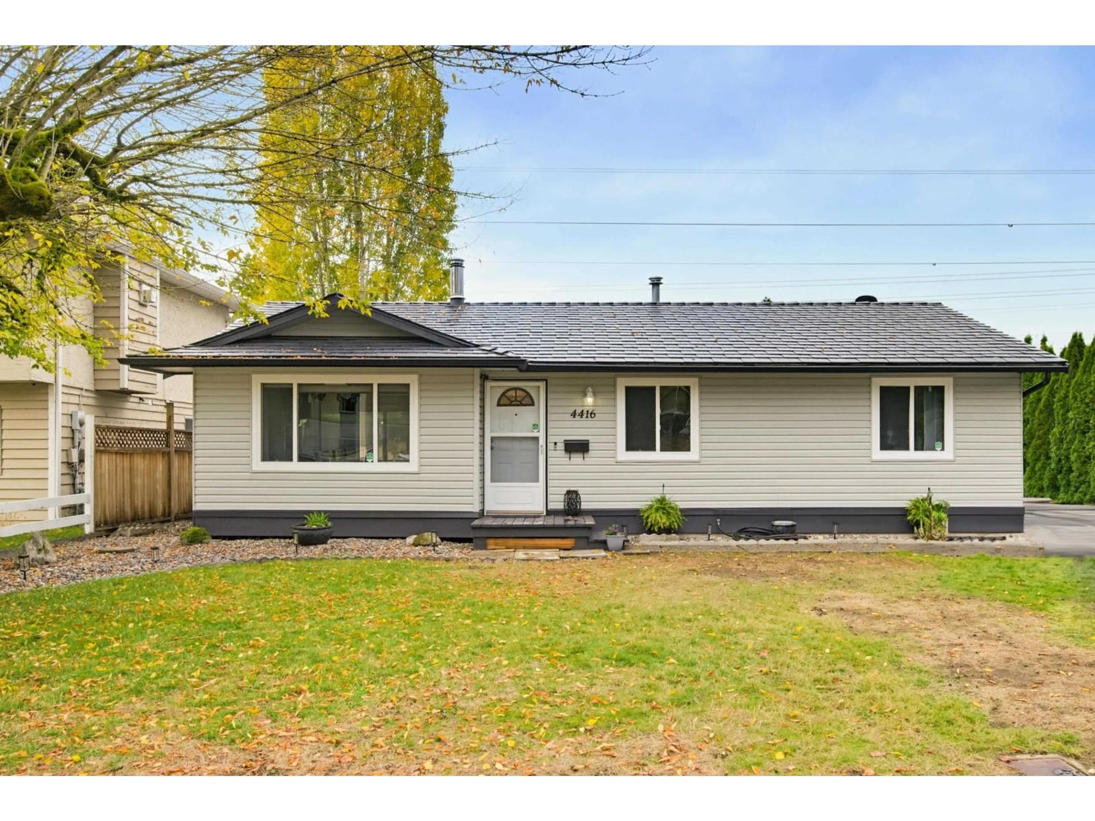 Home with vinyl exterior material, street for 4416 203 STREET, Langley British Columbia V3A6P7