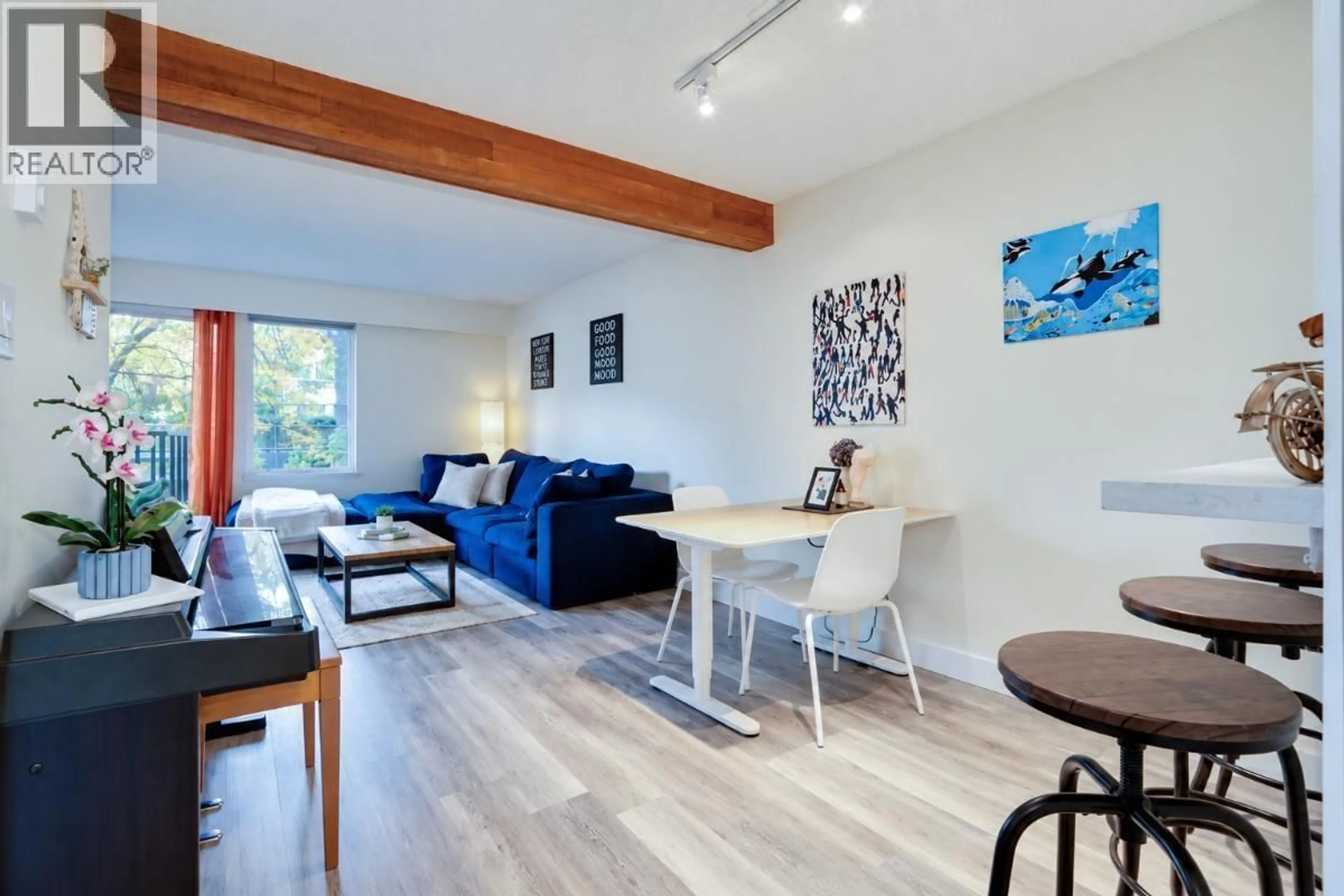 Living room with furniture, wood/laminate floor for 210 - 1274 BARCLAY STREET, Vancouver British Columbia V6E1H3