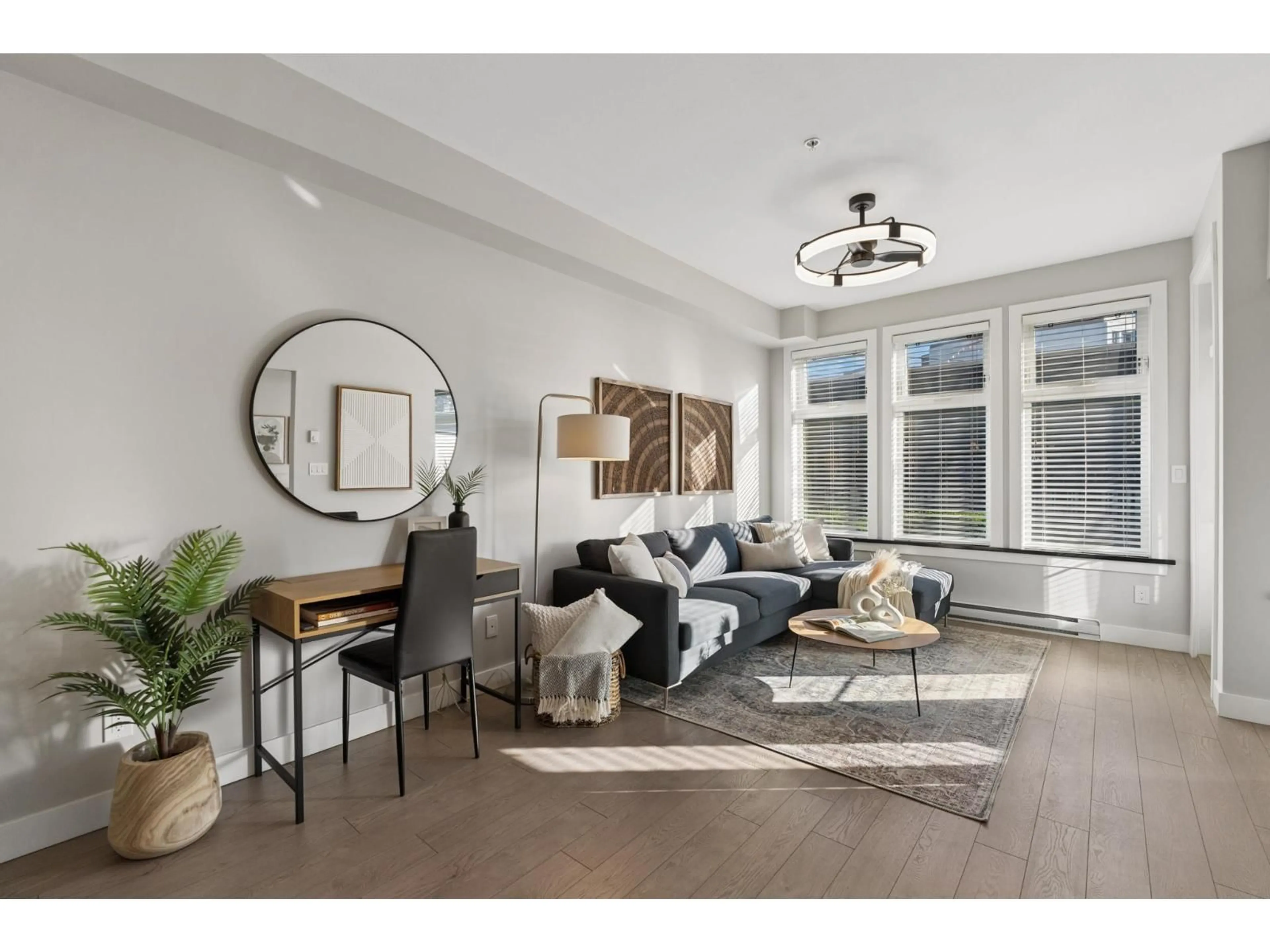 Living room with furniture, wood/laminate floor for 105 - 20078 FRASER HIGHWAY, Langley British Columbia V3A0J2