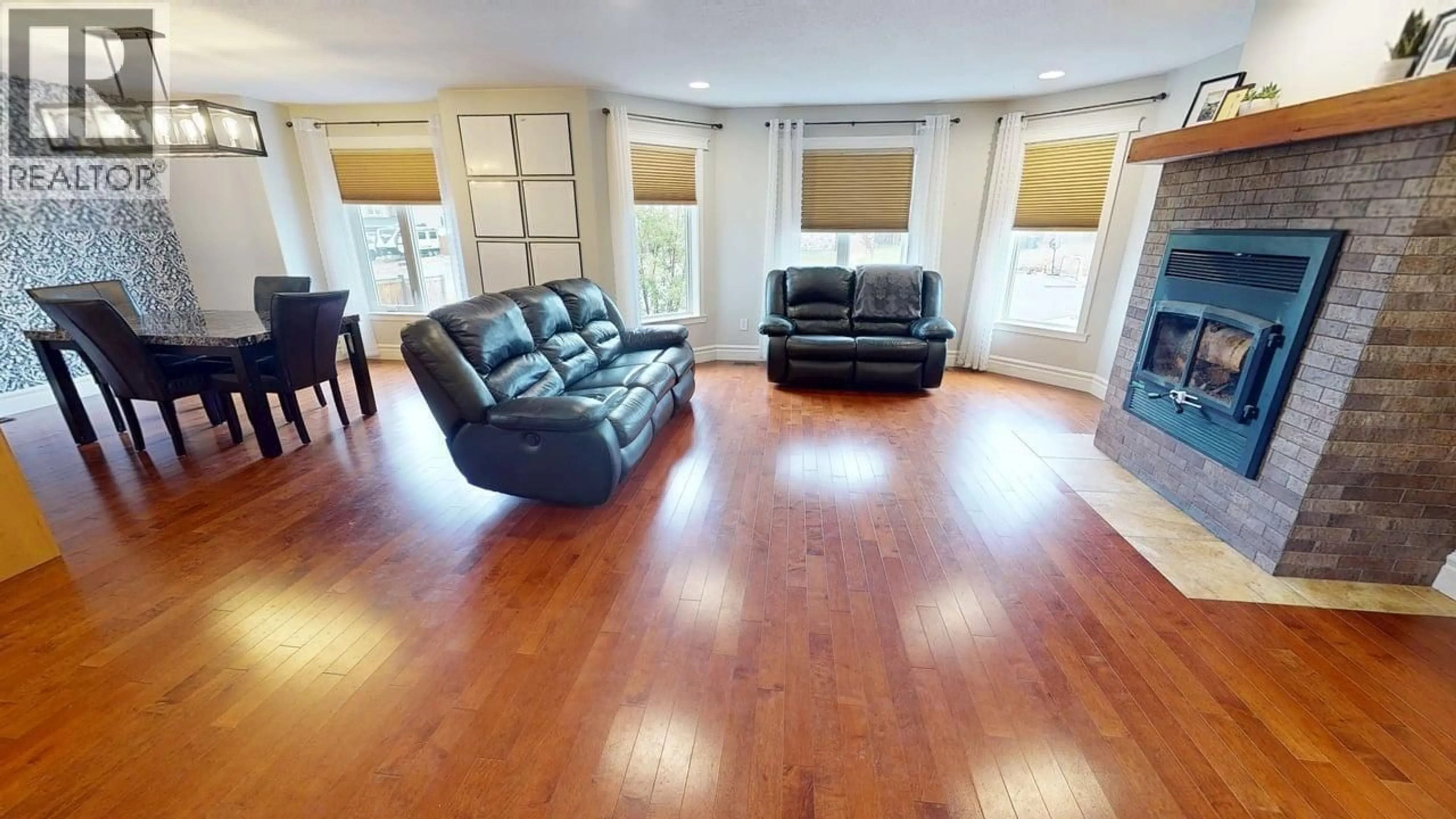 Living room with furniture, wood/laminate floor for 11716 88 STREET, Fort St. John British Columbia V1J0H8