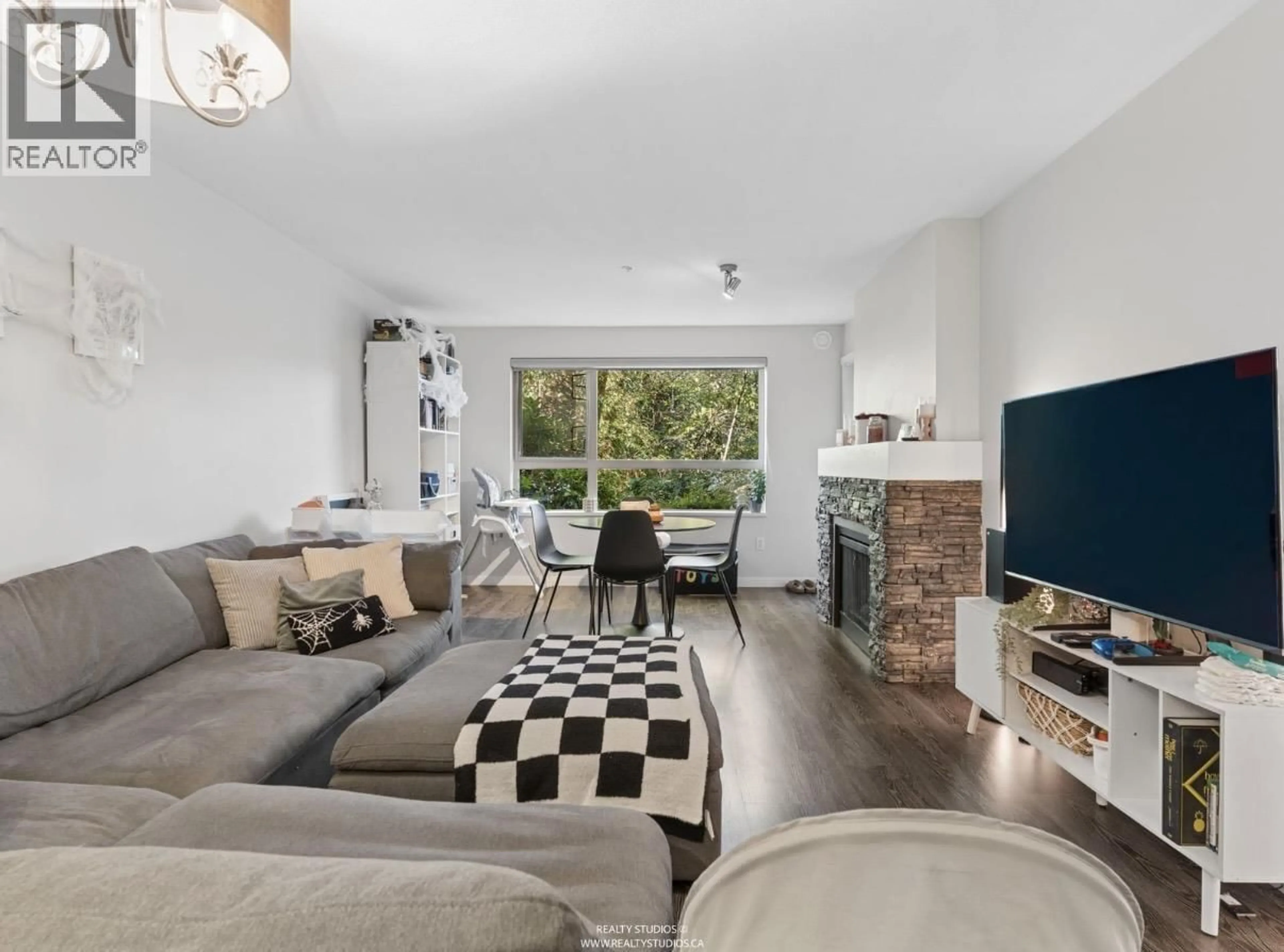 Living room with furniture, unknown for 103 - 700 KLAHANIE DRIVE, Port Moody British Columbia V3H5L3