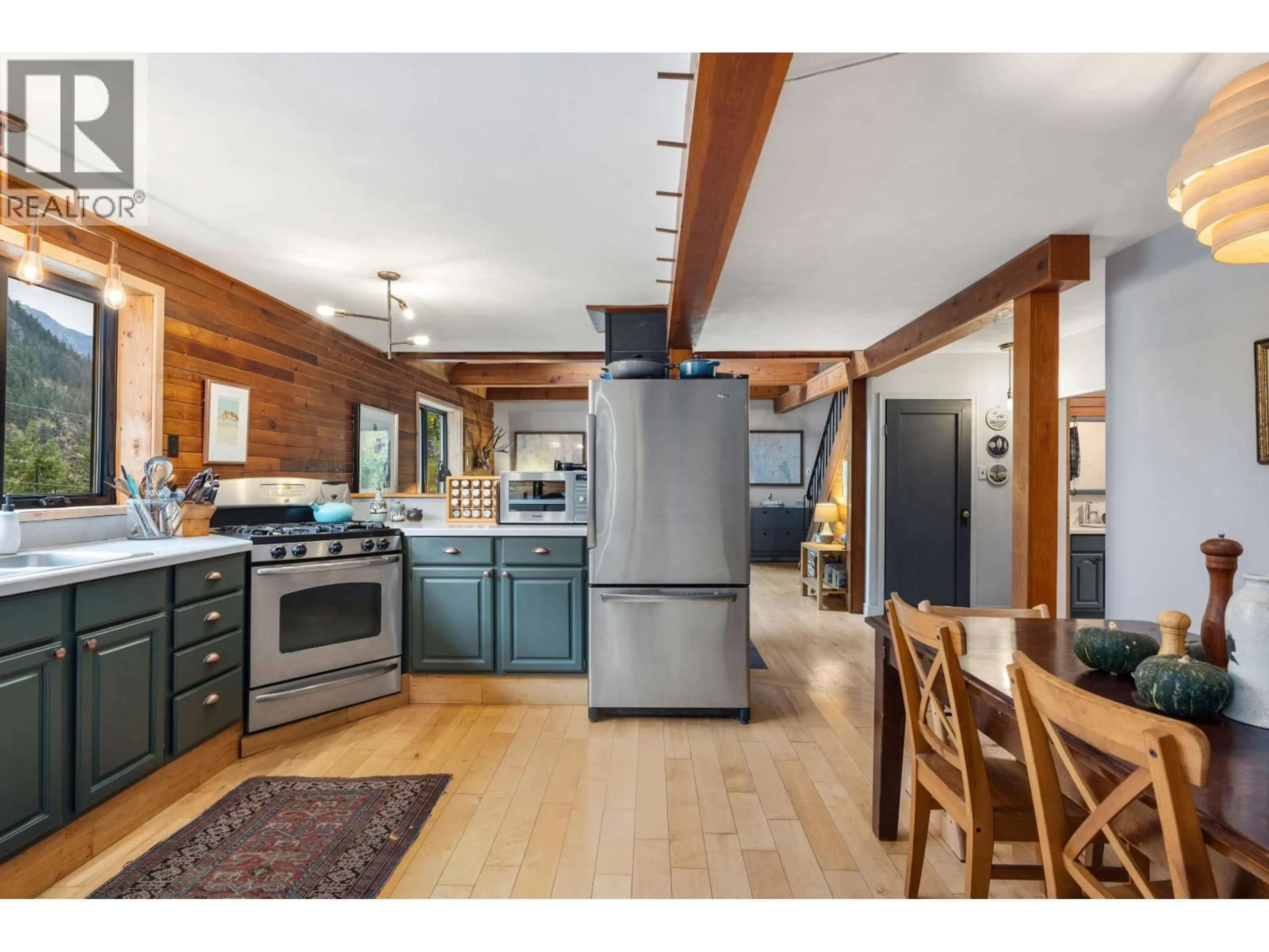 Open concept kitchen, wood/laminate floor for 9521 PEMBERTON PORTAGE ROAD, D'Arcy British Columbia V0N1L0