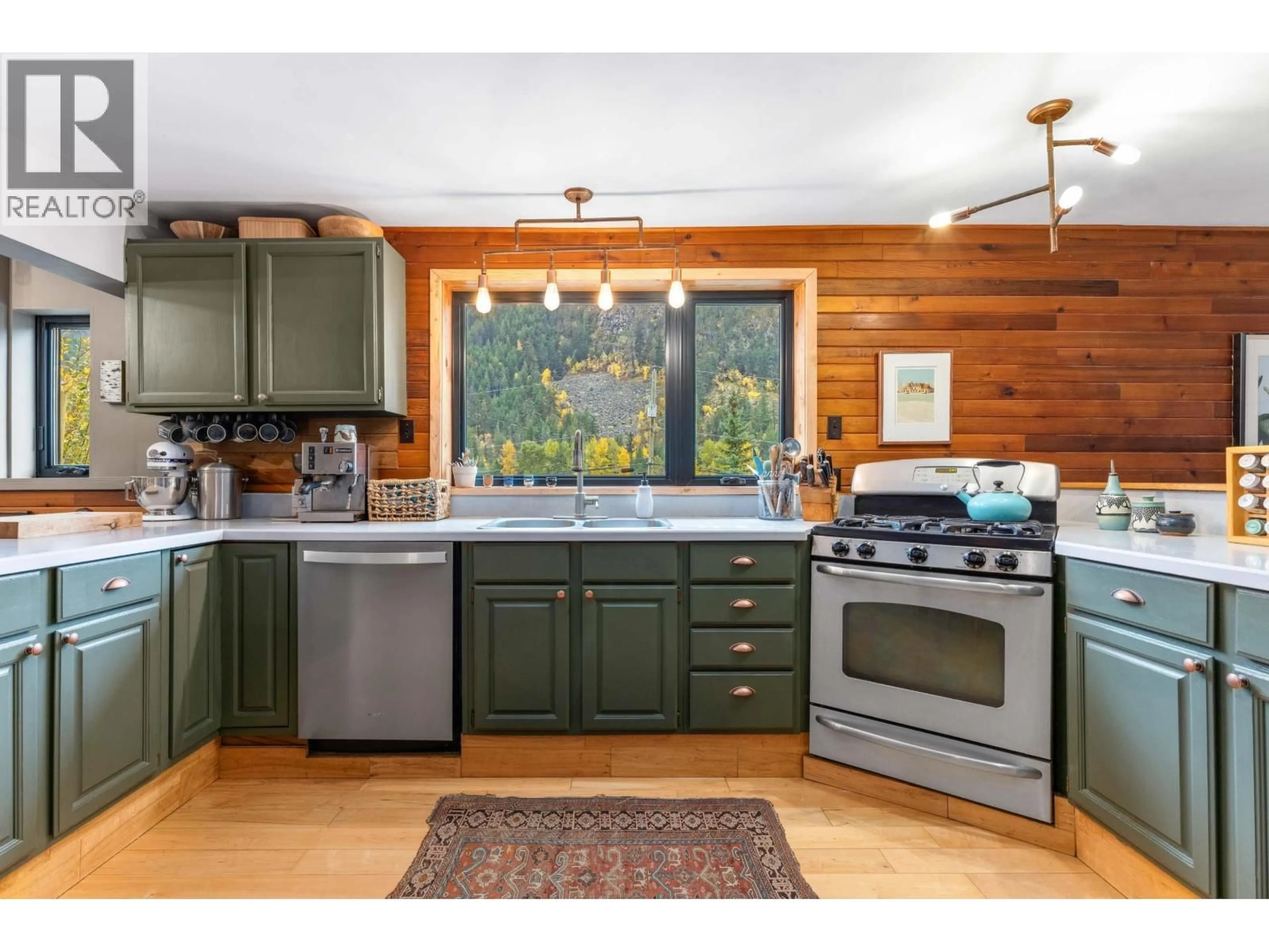 Open concept kitchen, wood/laminate floor for 9521 PEMBERTON PORTAGE ROAD, D'Arcy British Columbia V0N1L0