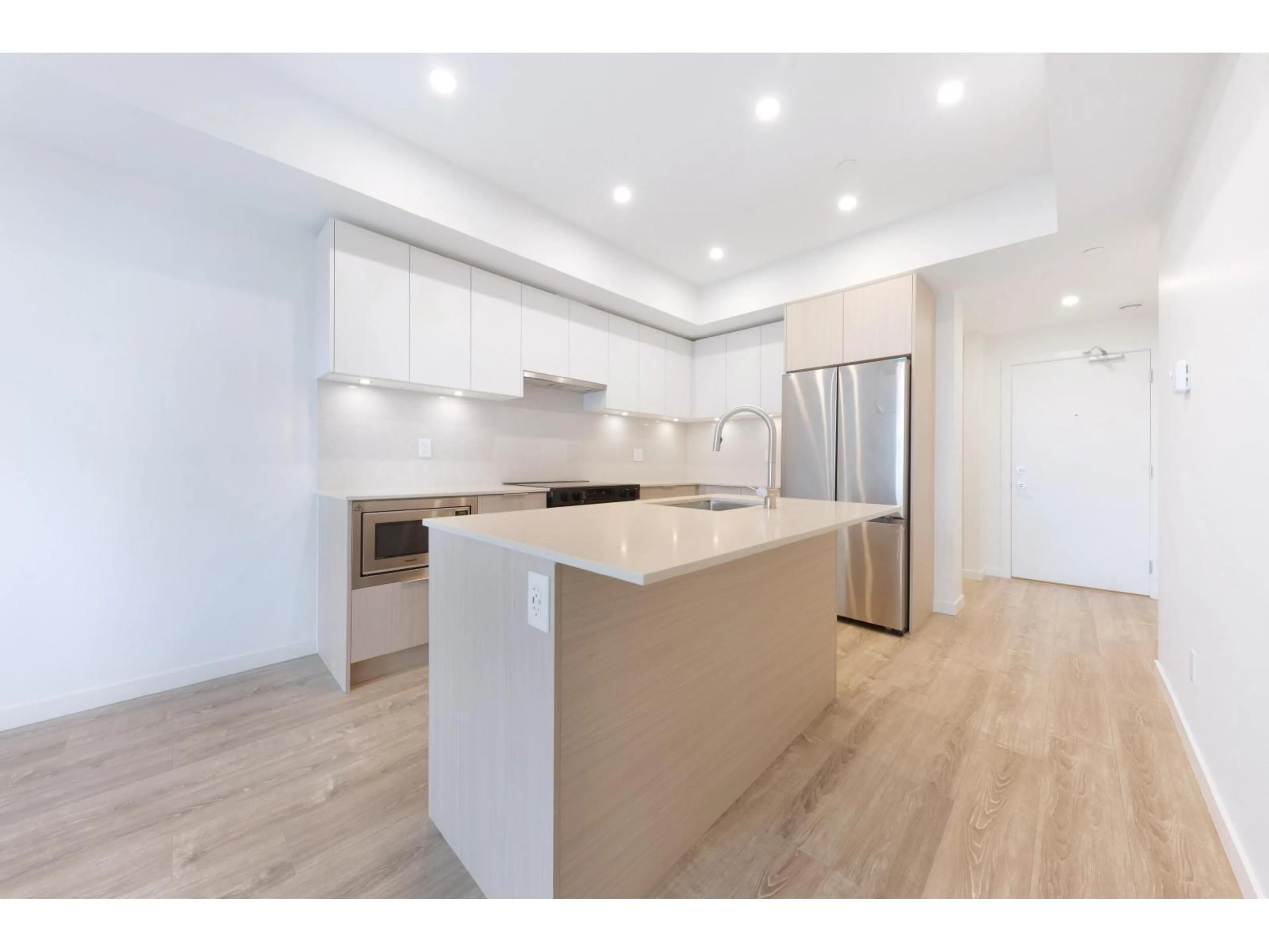 Open concept kitchen, wood/laminate floor for 607 - 10828 139A STREET, Surrey British Columbia V3R0H3