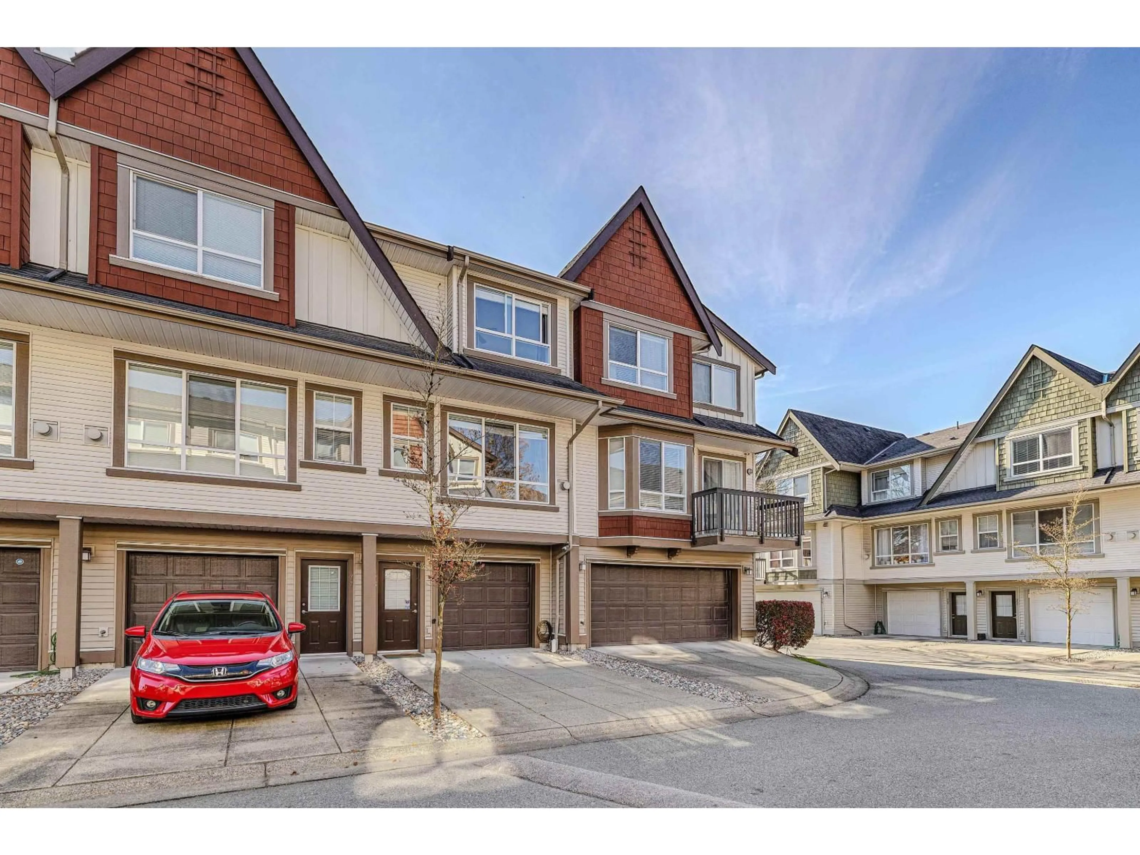 A pic from outside/outdoor area/front of a property/back of a property/a pic from drone, street for 76 - 7155 189 STREET, Surrey British Columbia V4N5S8