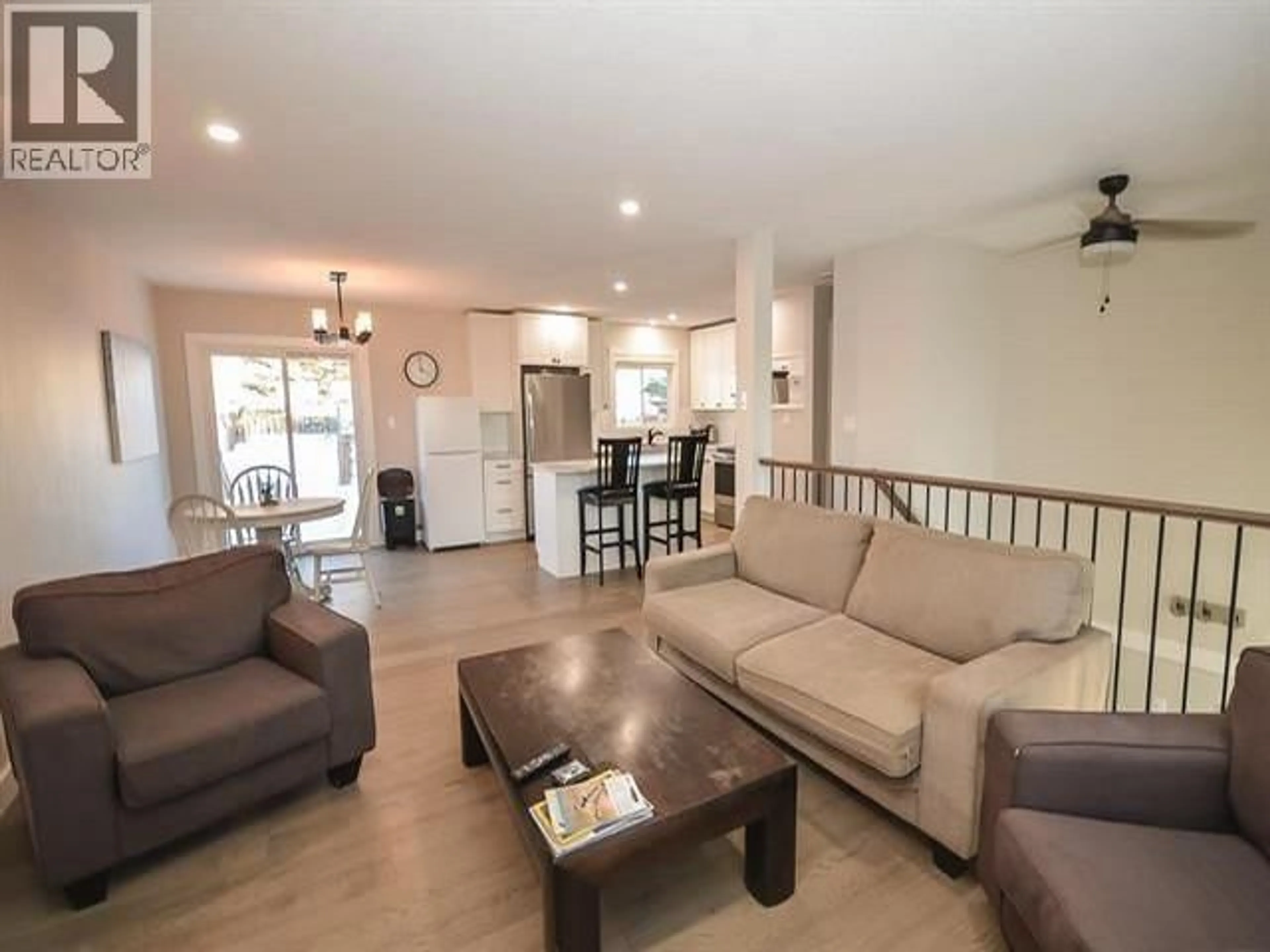Living room with furniture, wood/laminate floor for 8923 87 STREET, Fort St. John British Columbia V1J5H3