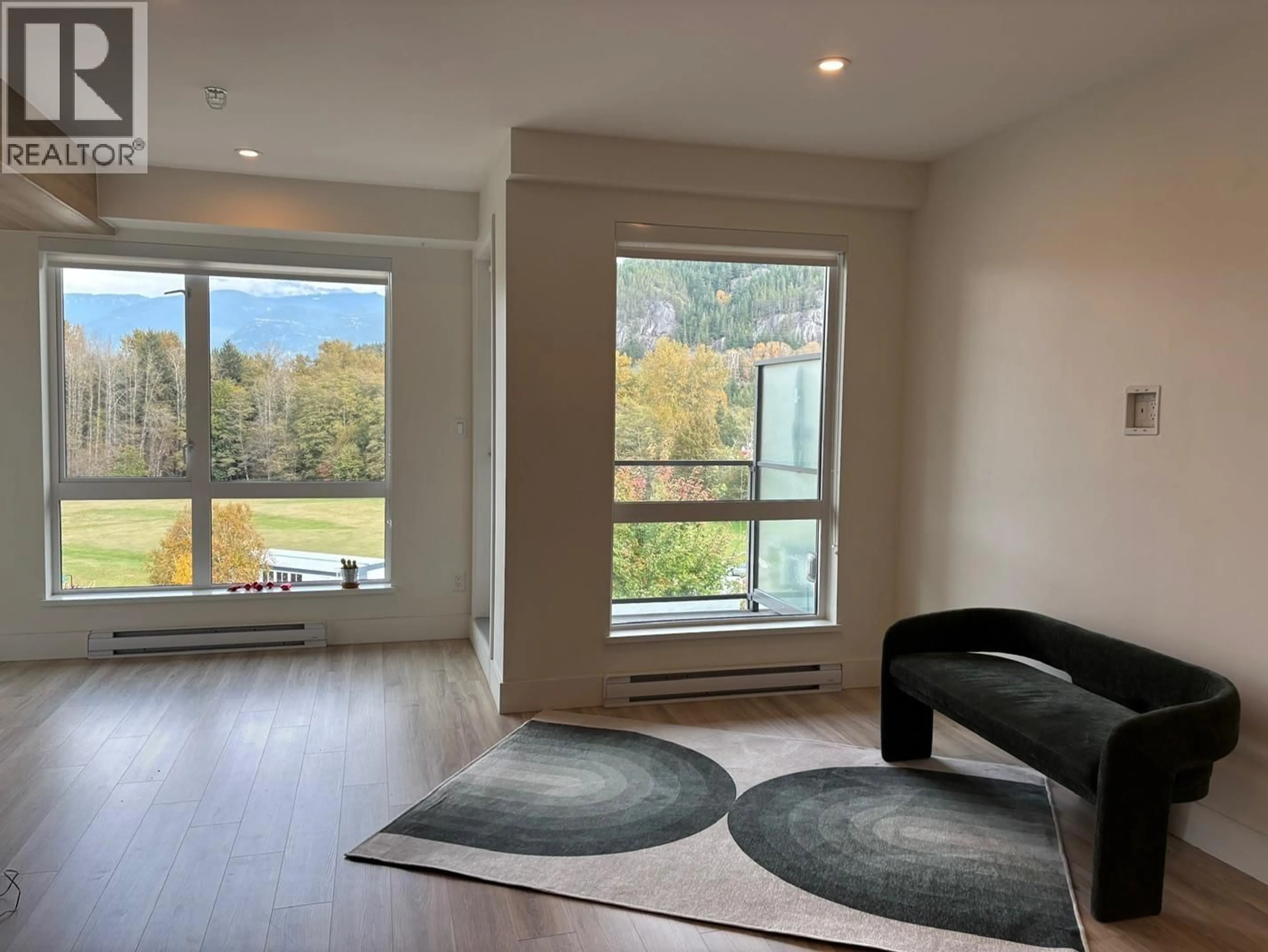 Living room with furniture, wood/laminate floor for 614 - 38362 BUCKLEY AVENUE, Squamish British Columbia V8B0J8