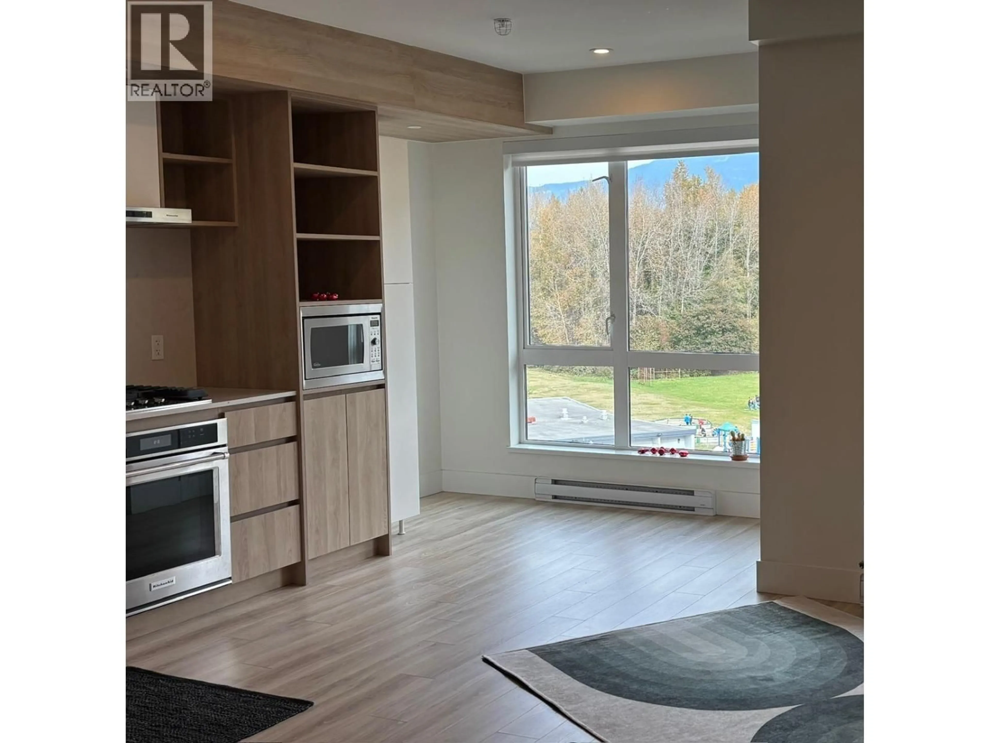 Open concept kitchen, wood/laminate floor for 614 - 38362 BUCKLEY AVENUE, Squamish British Columbia V8B0J8