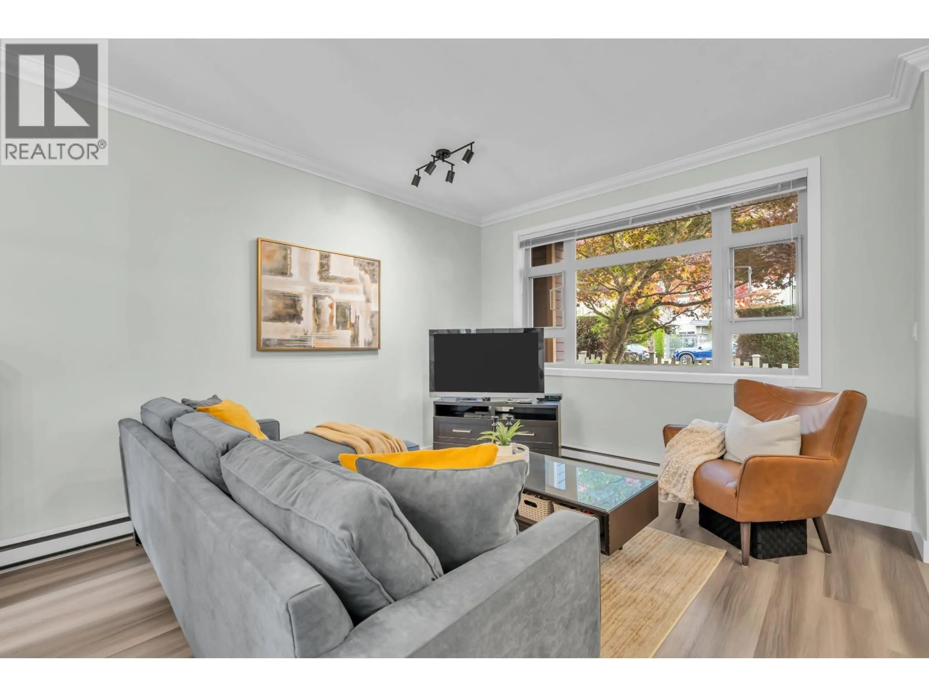 Living room with furniture, wood/laminate floor for 7345 MACPHERSON AVENUE, Burnaby British Columbia V5J0B2