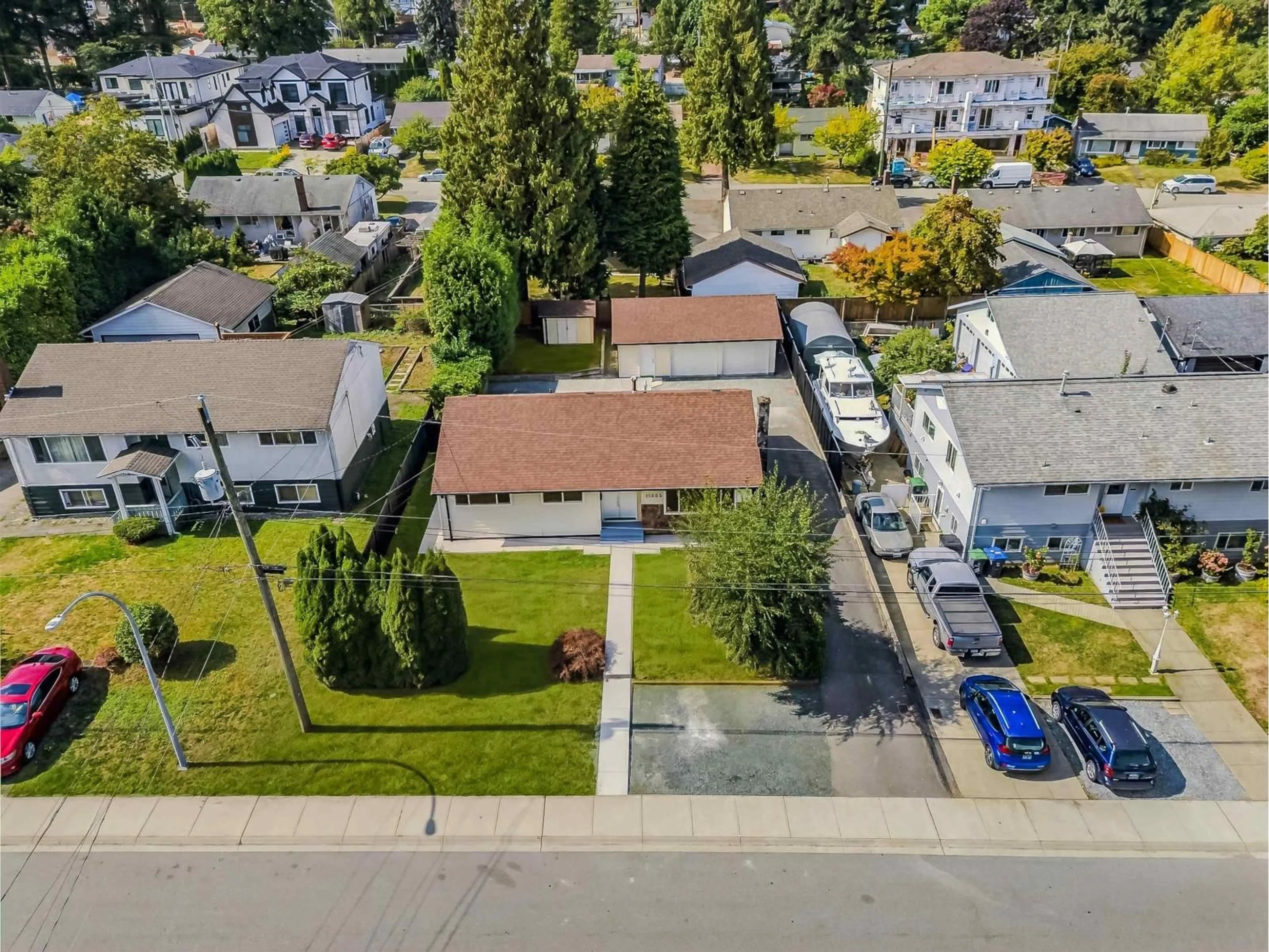 A pic from outside/outdoor area/front of a property/back of a property/a pic from drone, street for 11055 ORIOLE DRIVE, Surrey British Columbia V3R5A7