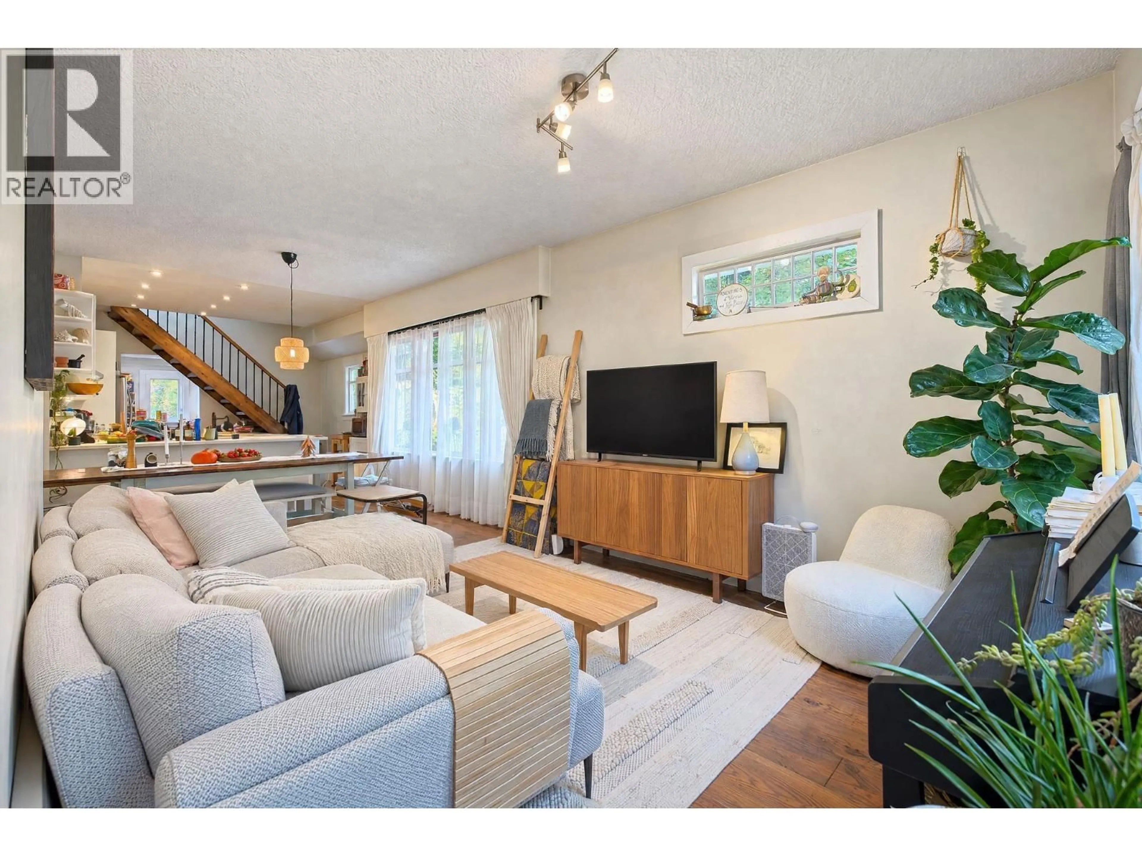 Living room with furniture, wood/laminate floor for 1701 SEMLIN DRIVE, Vancouver British Columbia V5N4P6