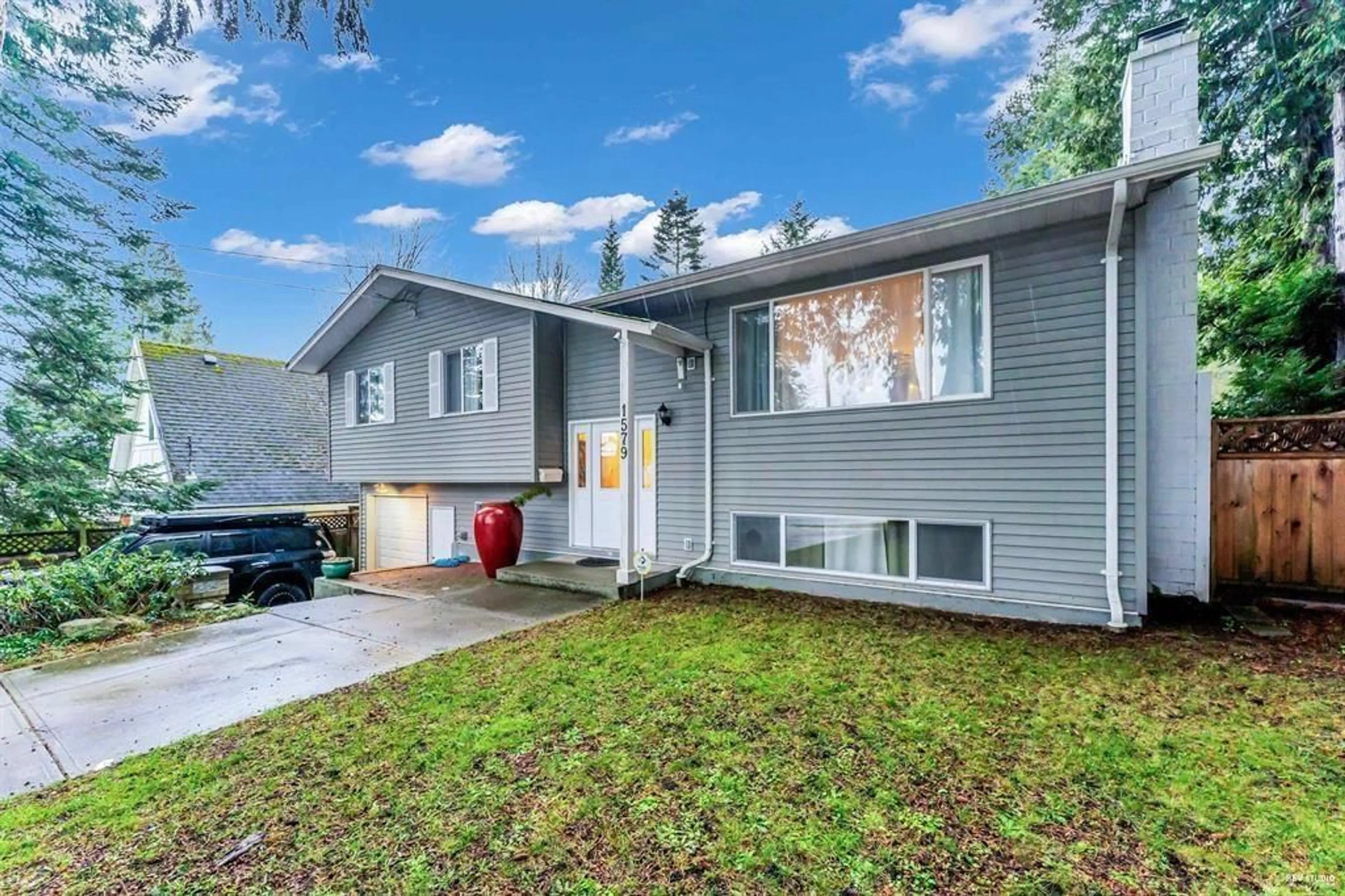 Home with vinyl exterior material, street for 1579 136 STREET, Surrey British Columbia V4A5H3
