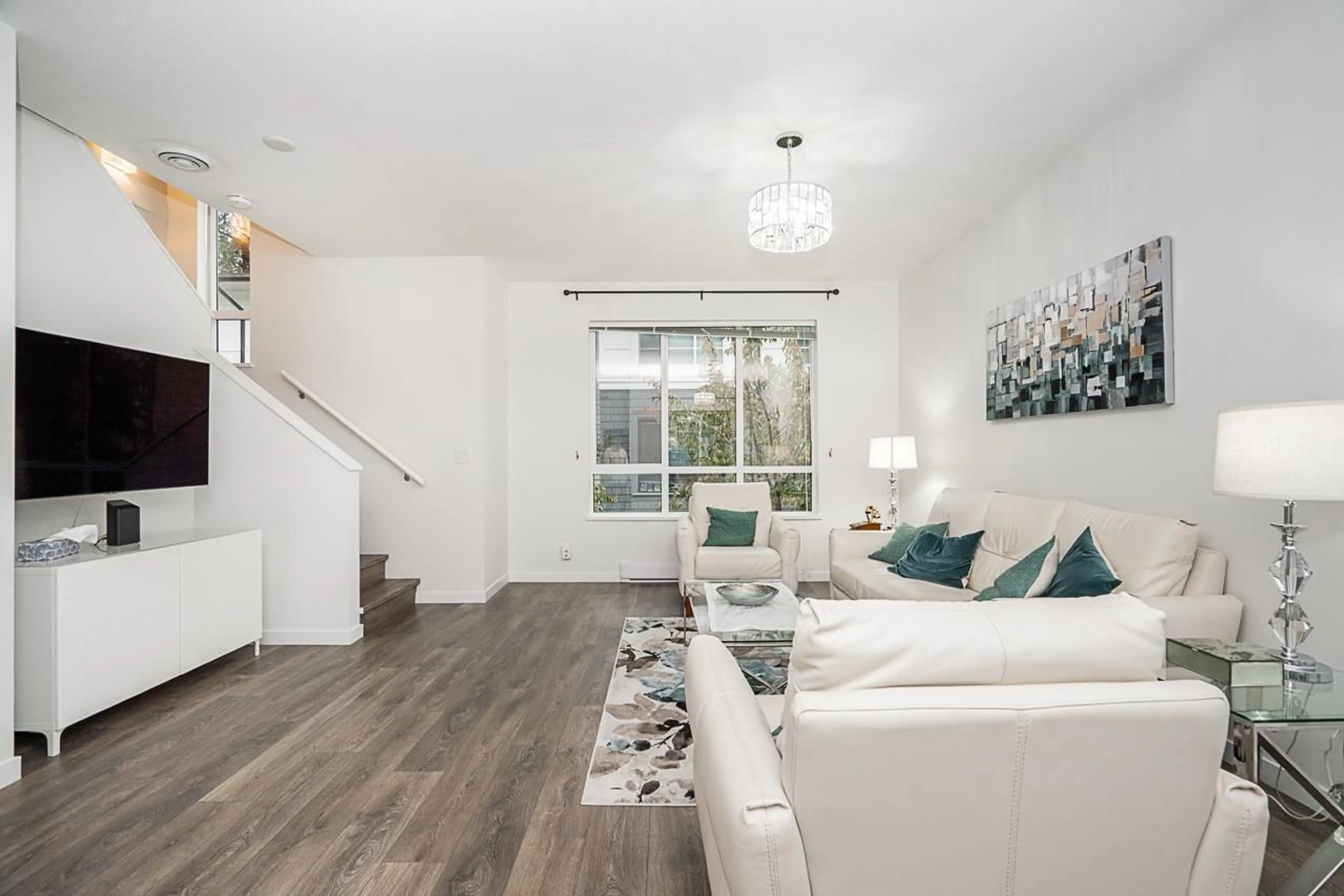 Living room with furniture, wood/laminate floor for 802 - 18505 LAURENSEN PLACE, Surrey British Columbia V4N6R7
