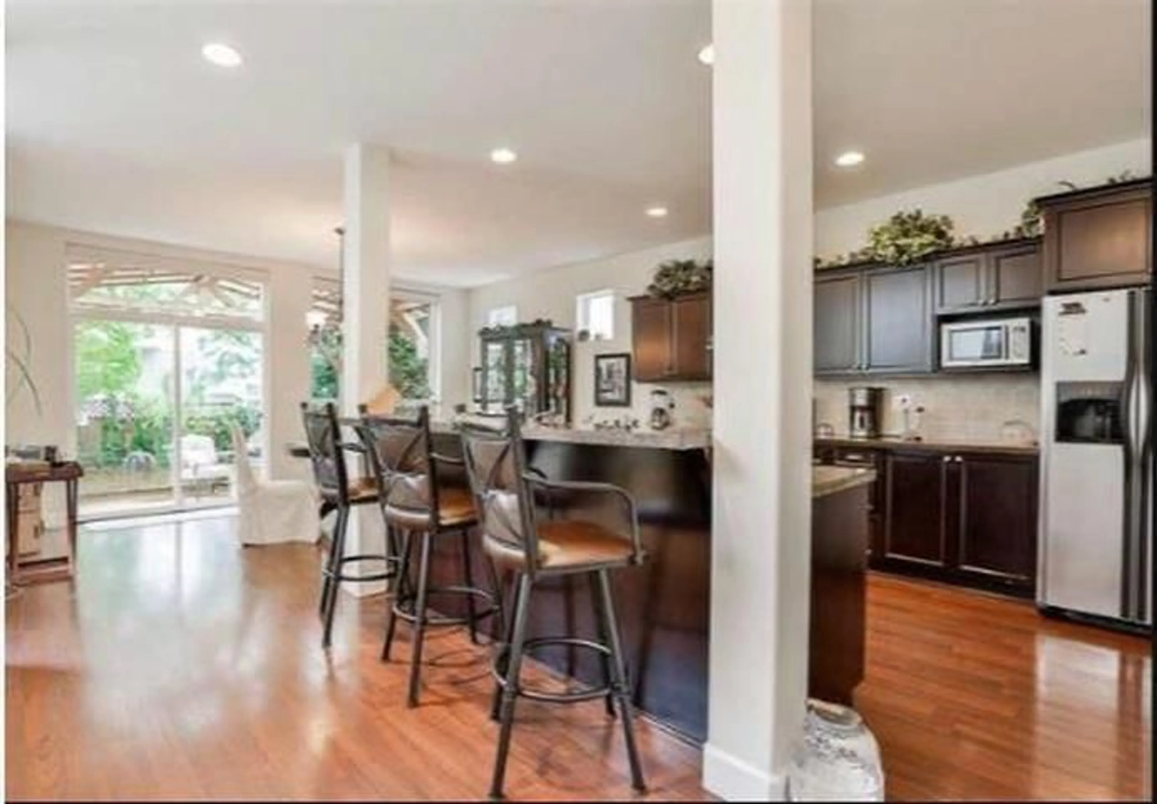 Open concept kitchen, wood/laminate floor for 8309 209A STREET, Langley British Columbia V2Y0A5