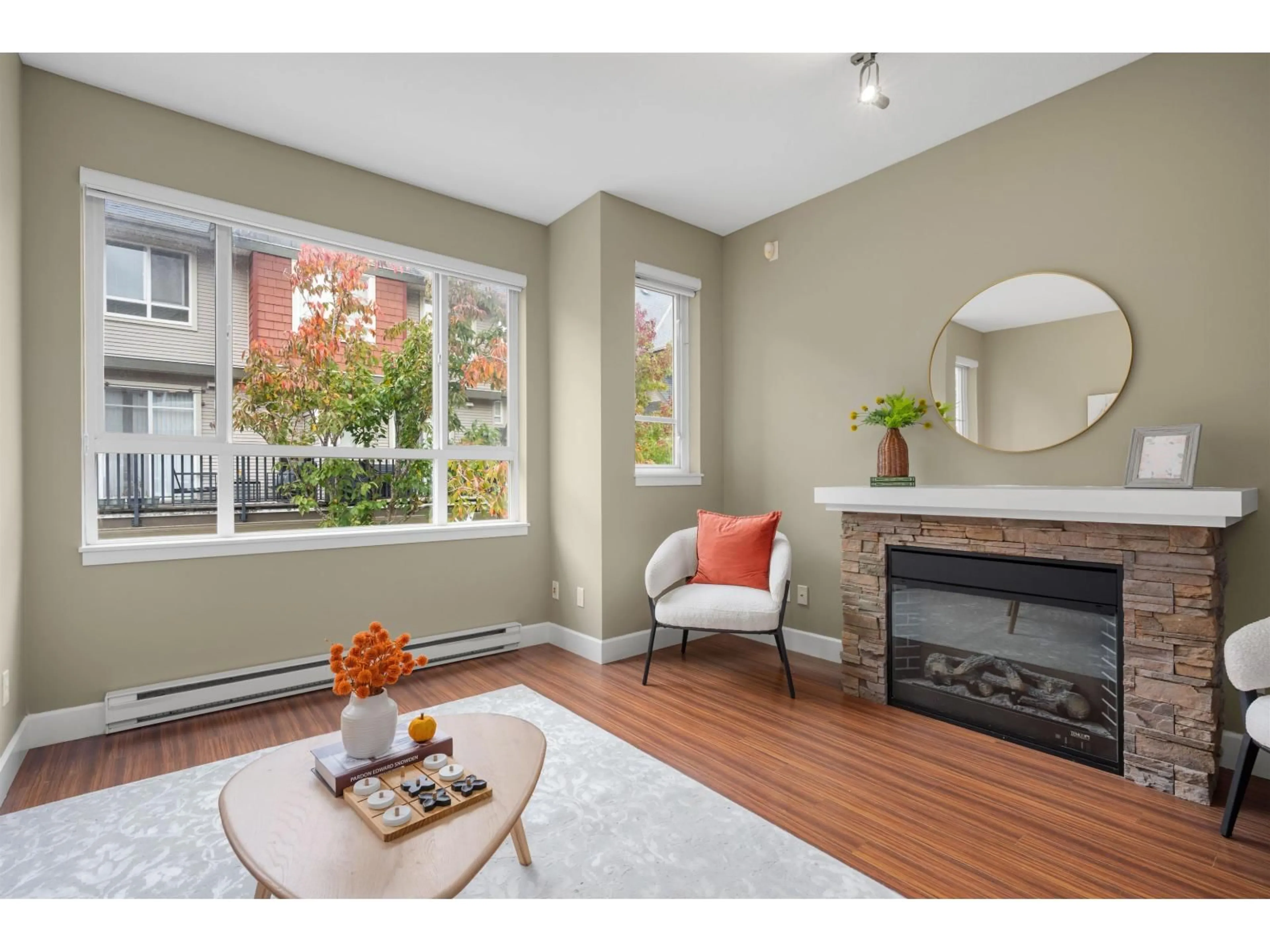 Living room with furniture, wood/laminate floor for 80 - 7088 191 STREET, Surrey British Columbia V4N0B4
