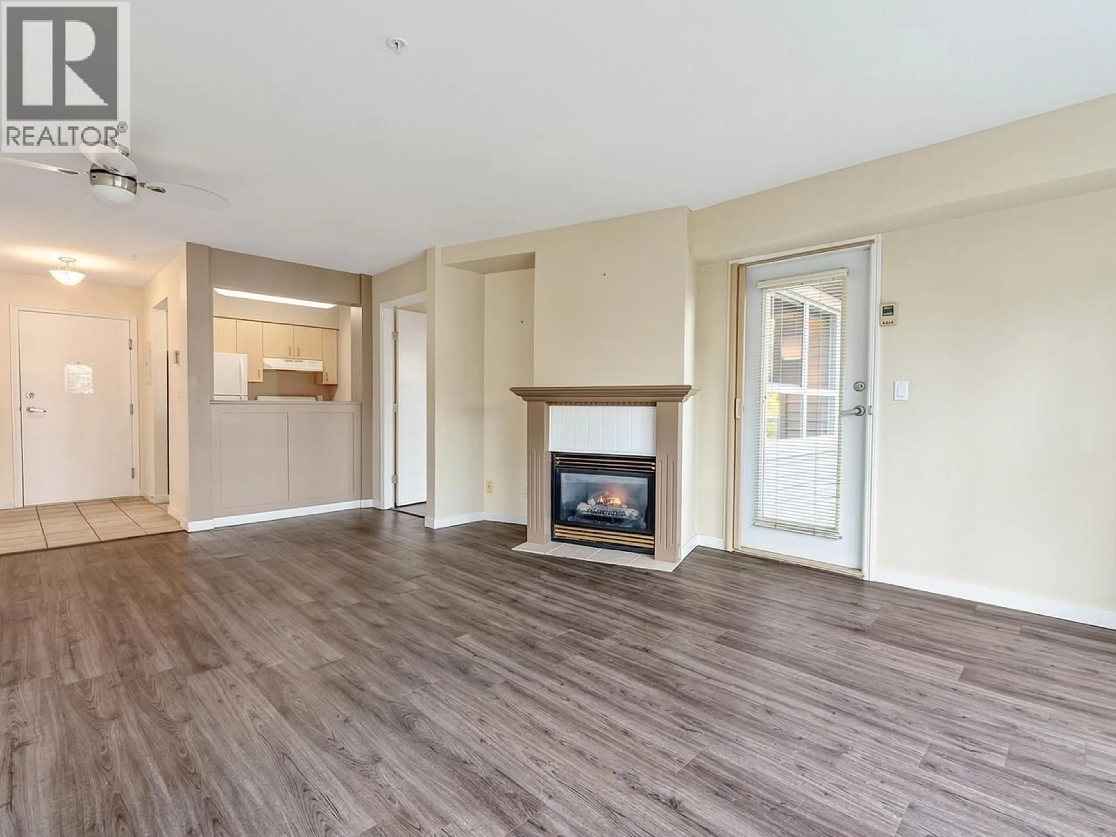 Living room with furniture, wood/laminate floor for 311 - 2266 ATKINS AVENUE, Port Coquitlam British Columbia V3C6N5