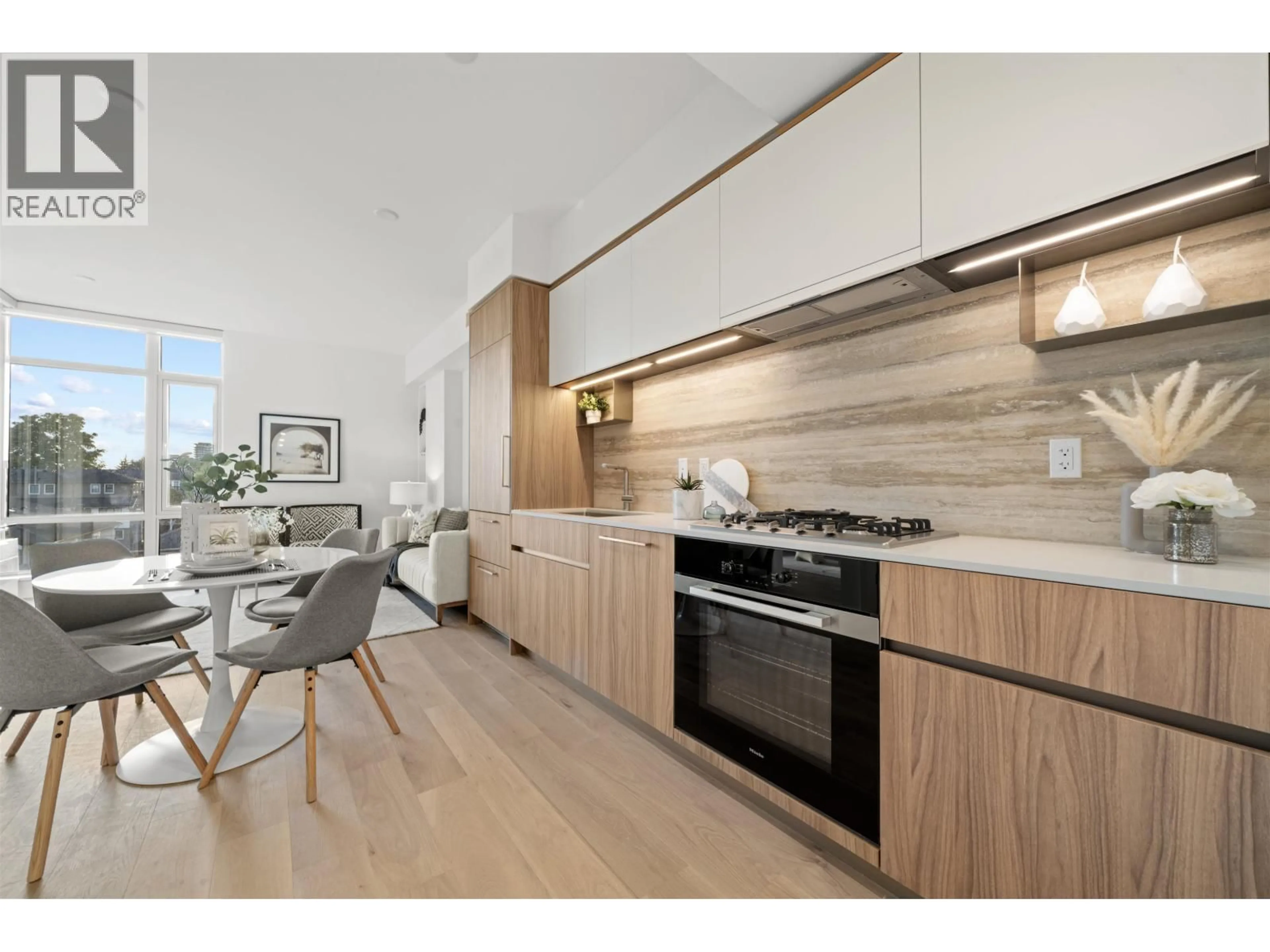 Open concept kitchen, wood/laminate floor for 104 - 8486 OAK STREET, Vancouver British Columbia V6P4B1