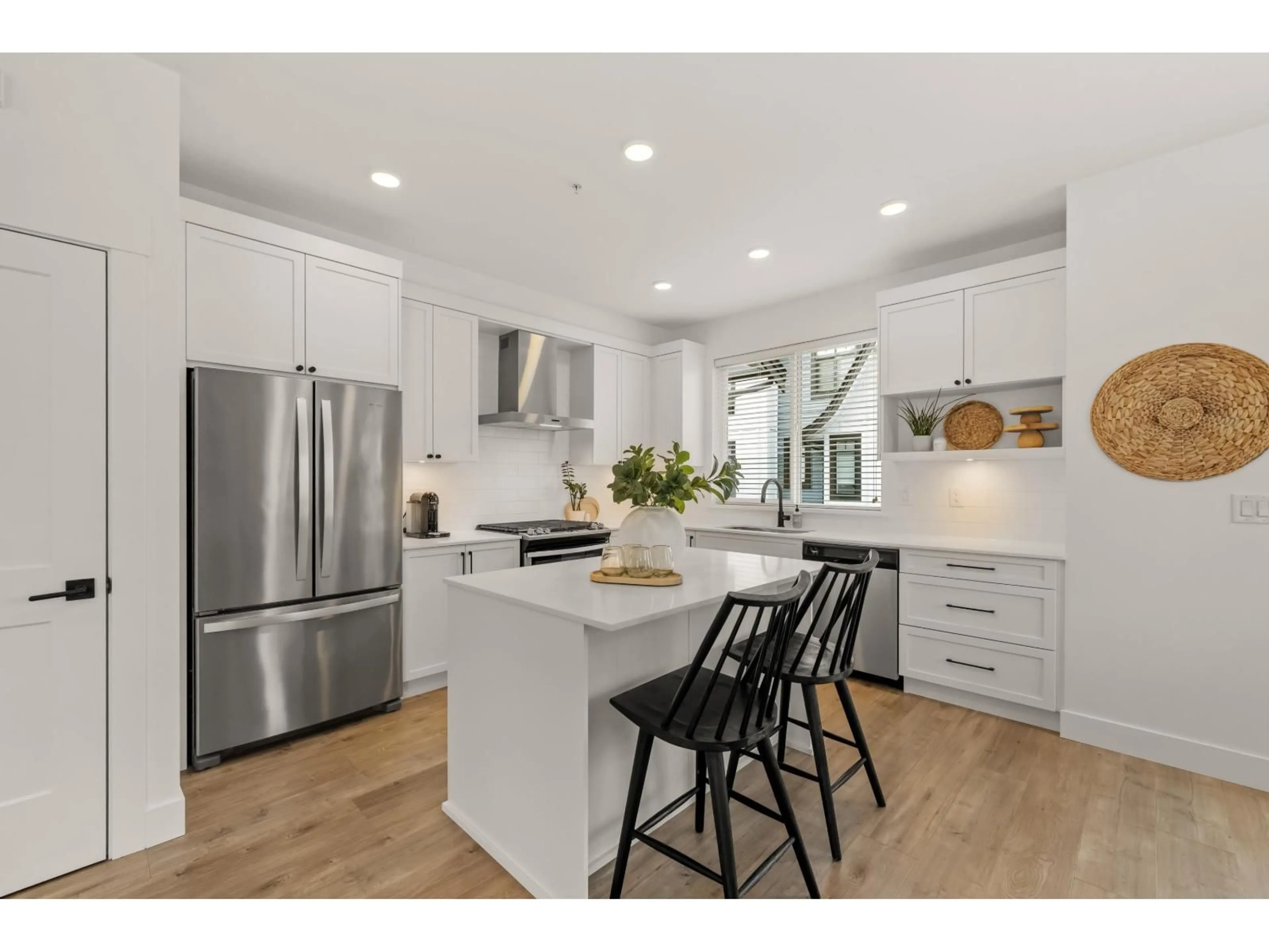 Open concept kitchen, wood/laminate floor for 18 - 6897 201 STREET, Langley British Columbia V2Y0Z3