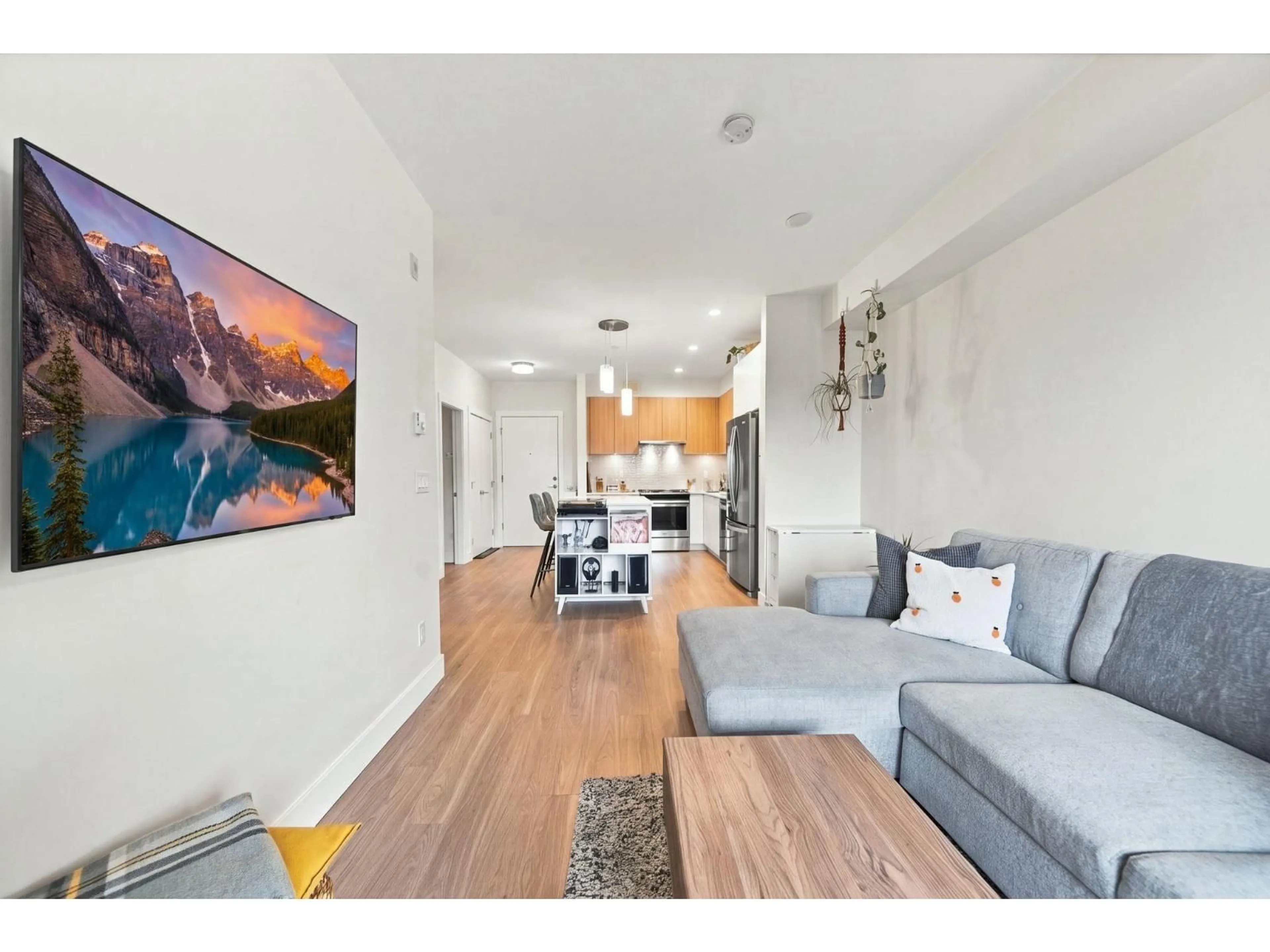 Living room with furniture, wood/laminate floor for A308 - 6950 NICHOLSON ROAD, Delta British Columbia V4E0A8